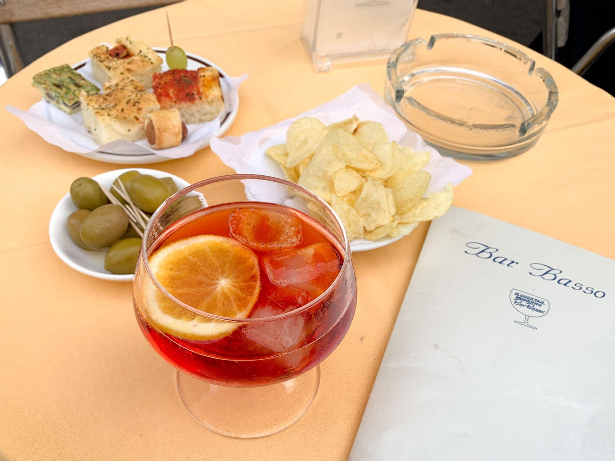 A typical Italian aperitivo: Negroni Sbagliato and snacks