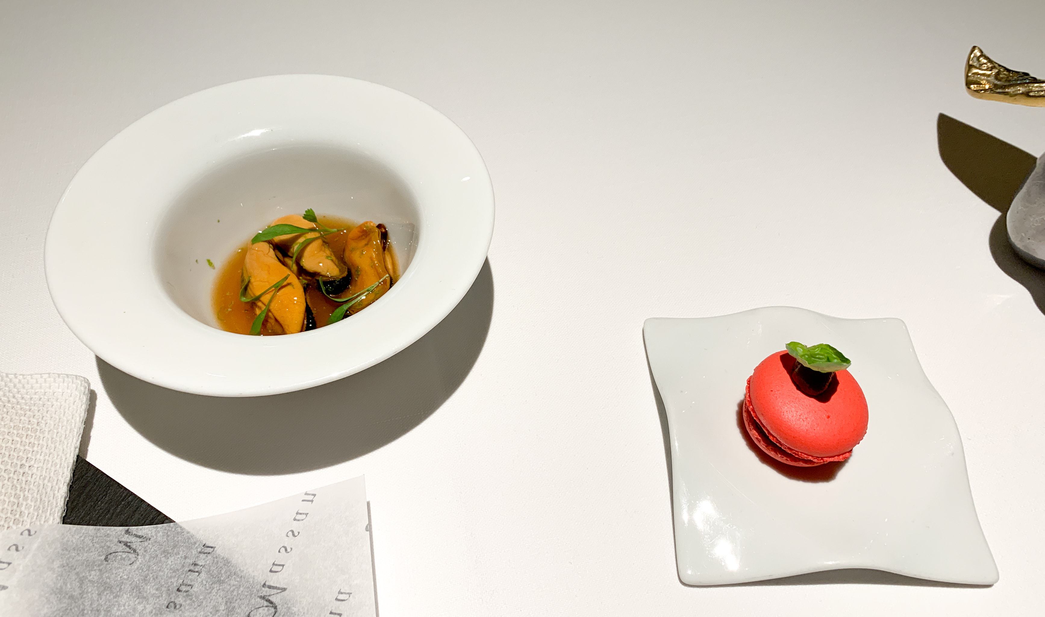 Marinated mussels, lime, and coriander (left), and "Macaron" caprese (right) at Massana Restaurant