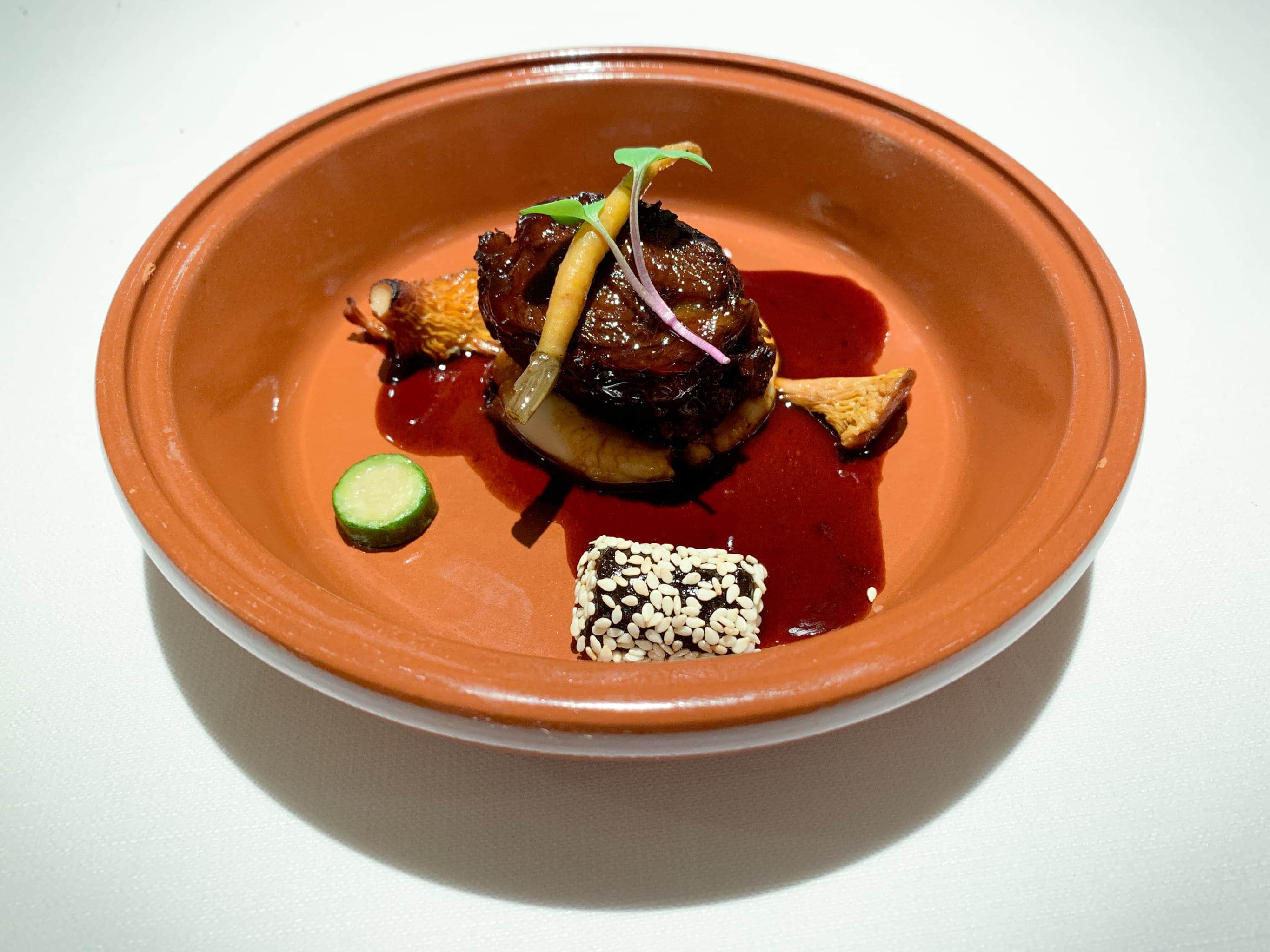 Oxcheek Tajine with white bean hummus, prune, and spices