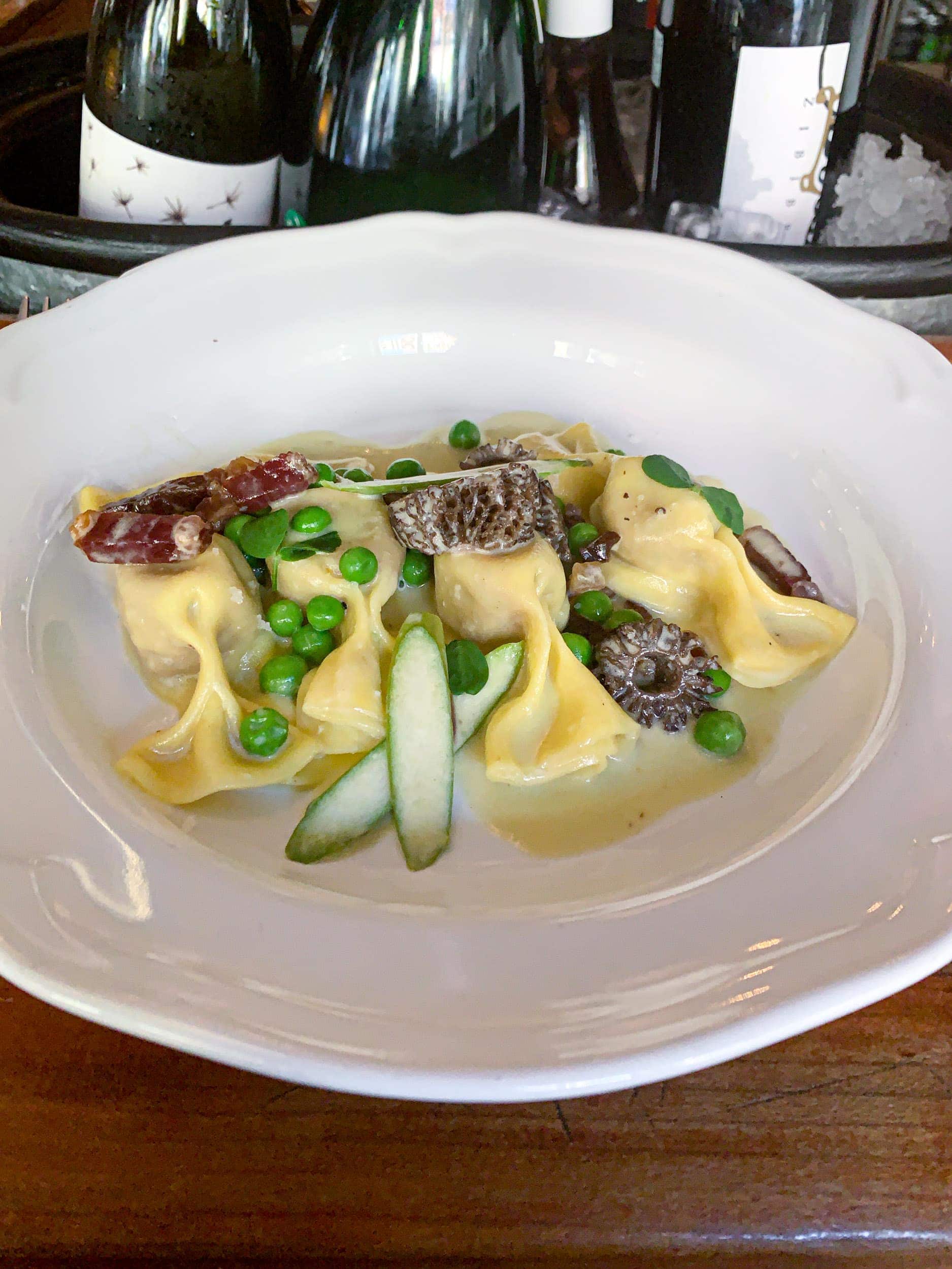 Caramelized onion and beef-stuffed pasta in asparagus butter