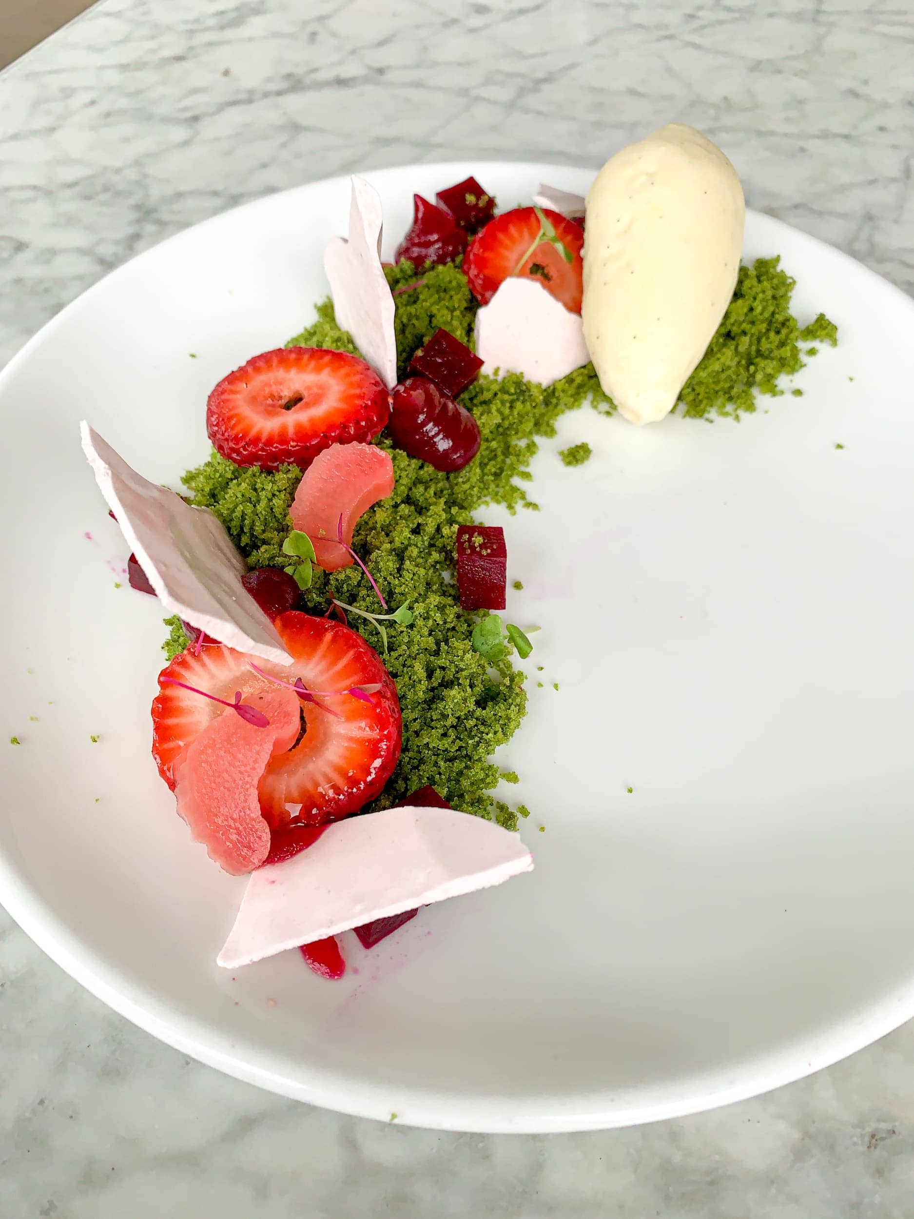 Arugula cake with strawberry, beet, basil, spirulina, and Tahitian vanilla ice cream