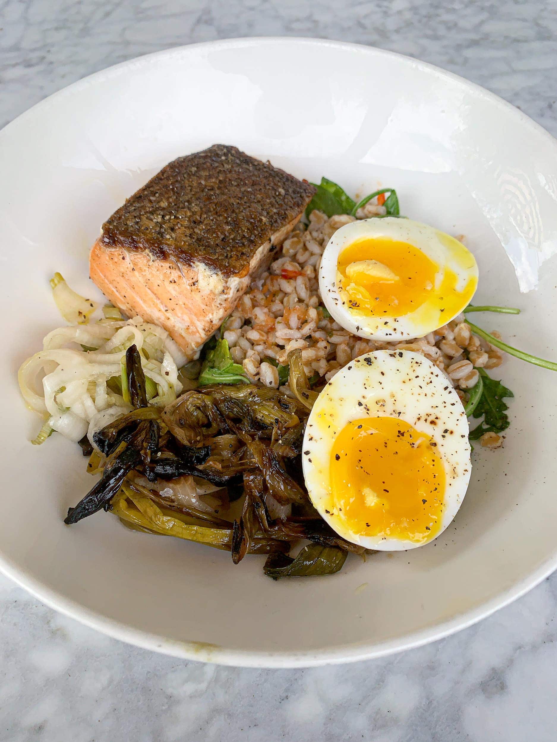 Salmon with farro, broccolini, pickled spring onion, and soft egg