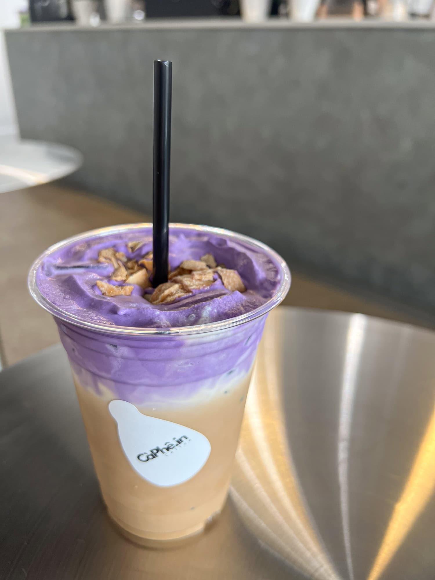 An iced coco ube coffee at CaPhe.in Coffee in downtown Austin, TX.