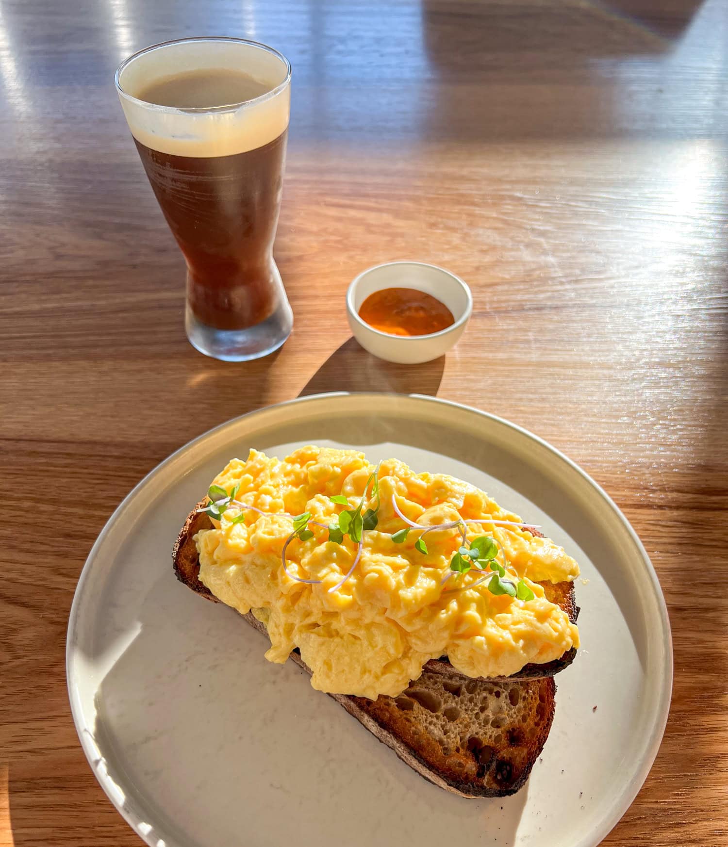 Nitro snap chill and egg on sourdough toast at Proud Mary Coffee.