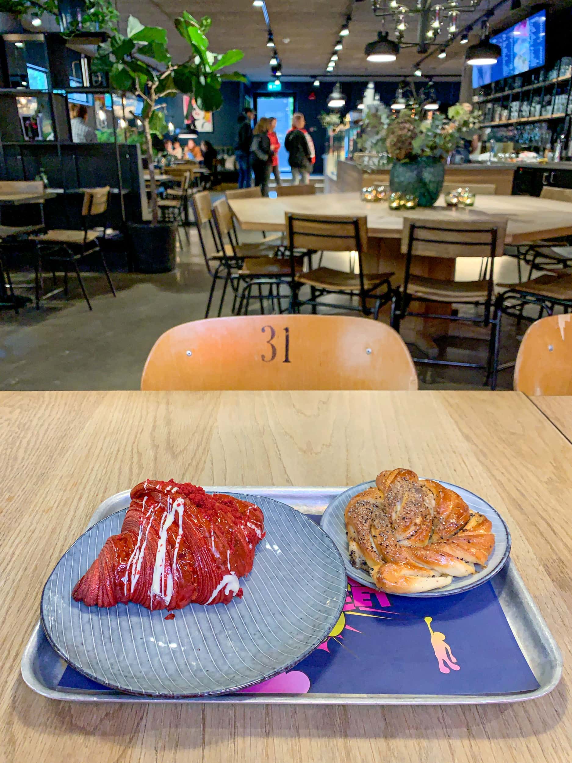 Red velvet croissant and cardamom bun during fika at Mr Cake in Stockholm