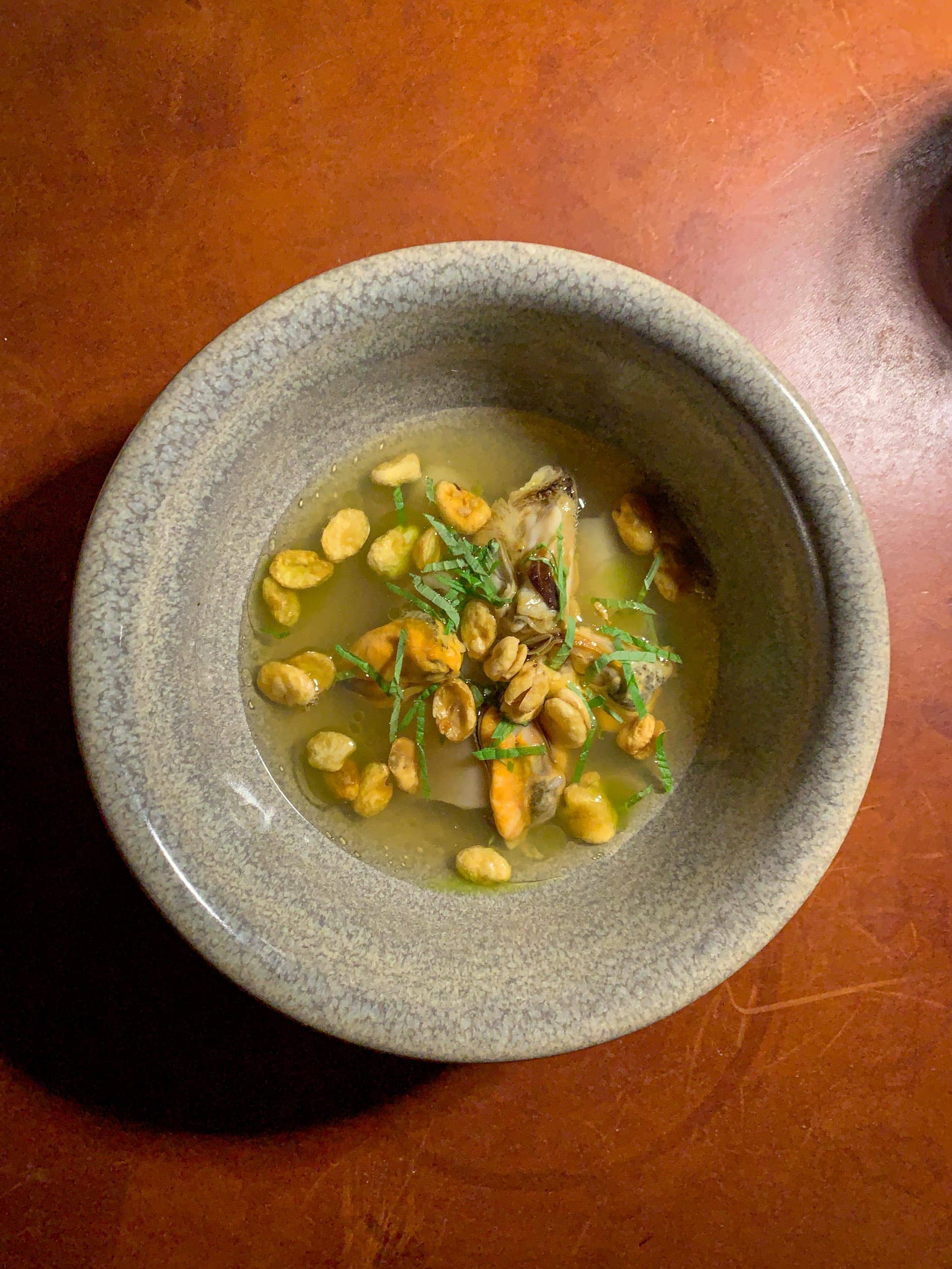 Clams, broad beans, tomato, and Verbena at Koka in Gothenburg