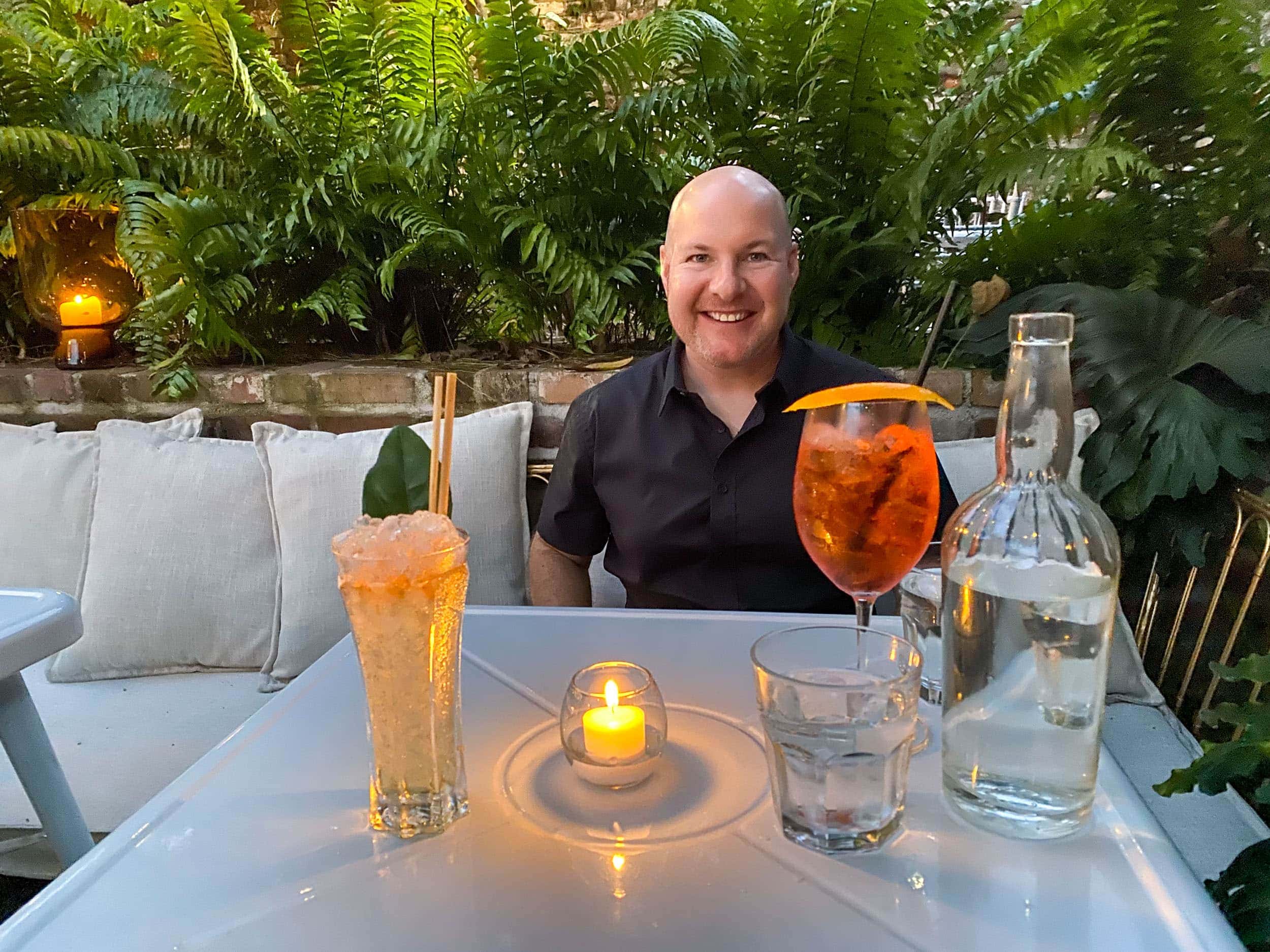 Dave on the patio at Jewel of the South, one of the best cocktail bars in New Orleans