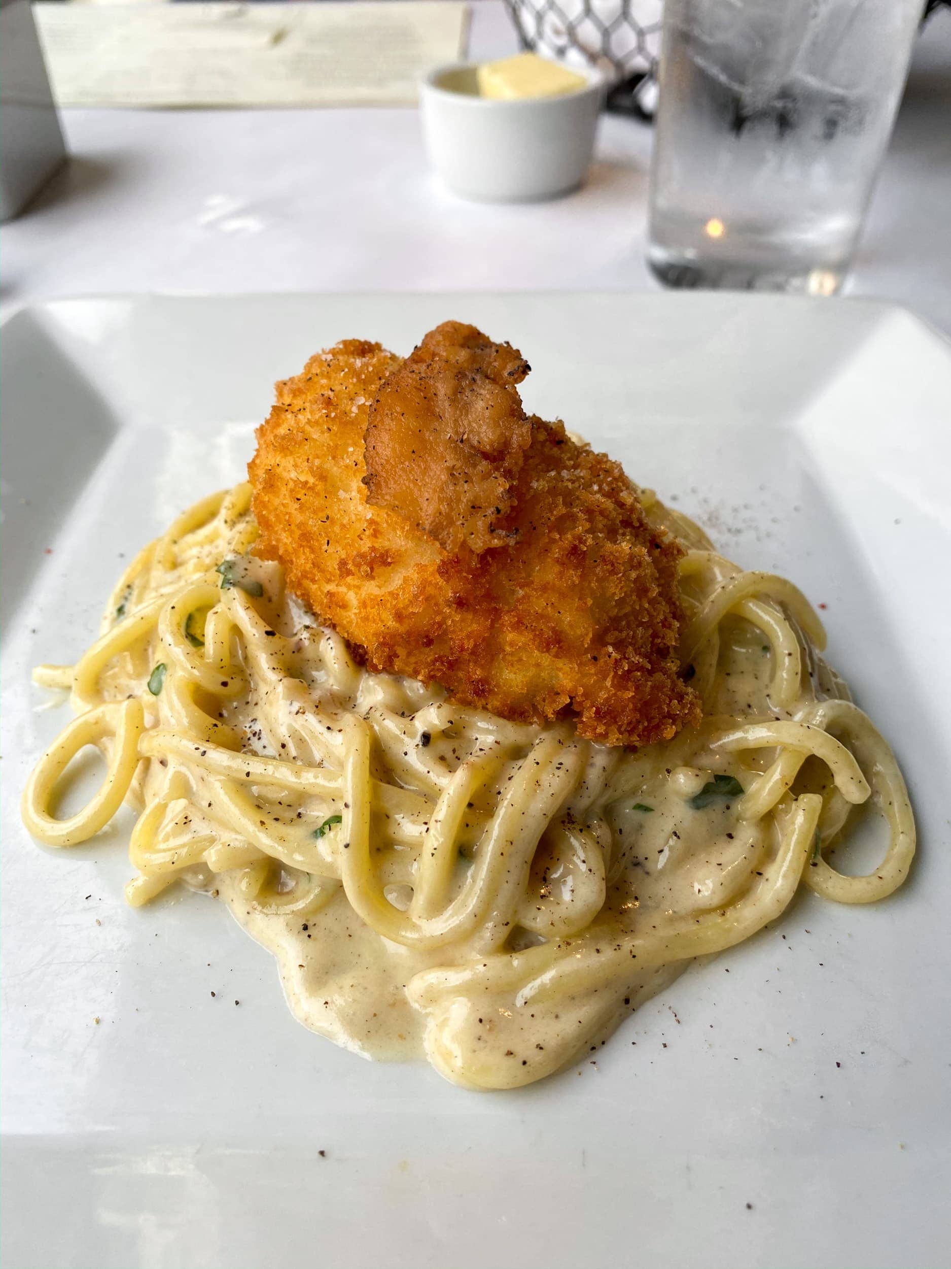 Spaghetti with guanciale and fried farm egg at Herbsaint, a Donald Link restaurant