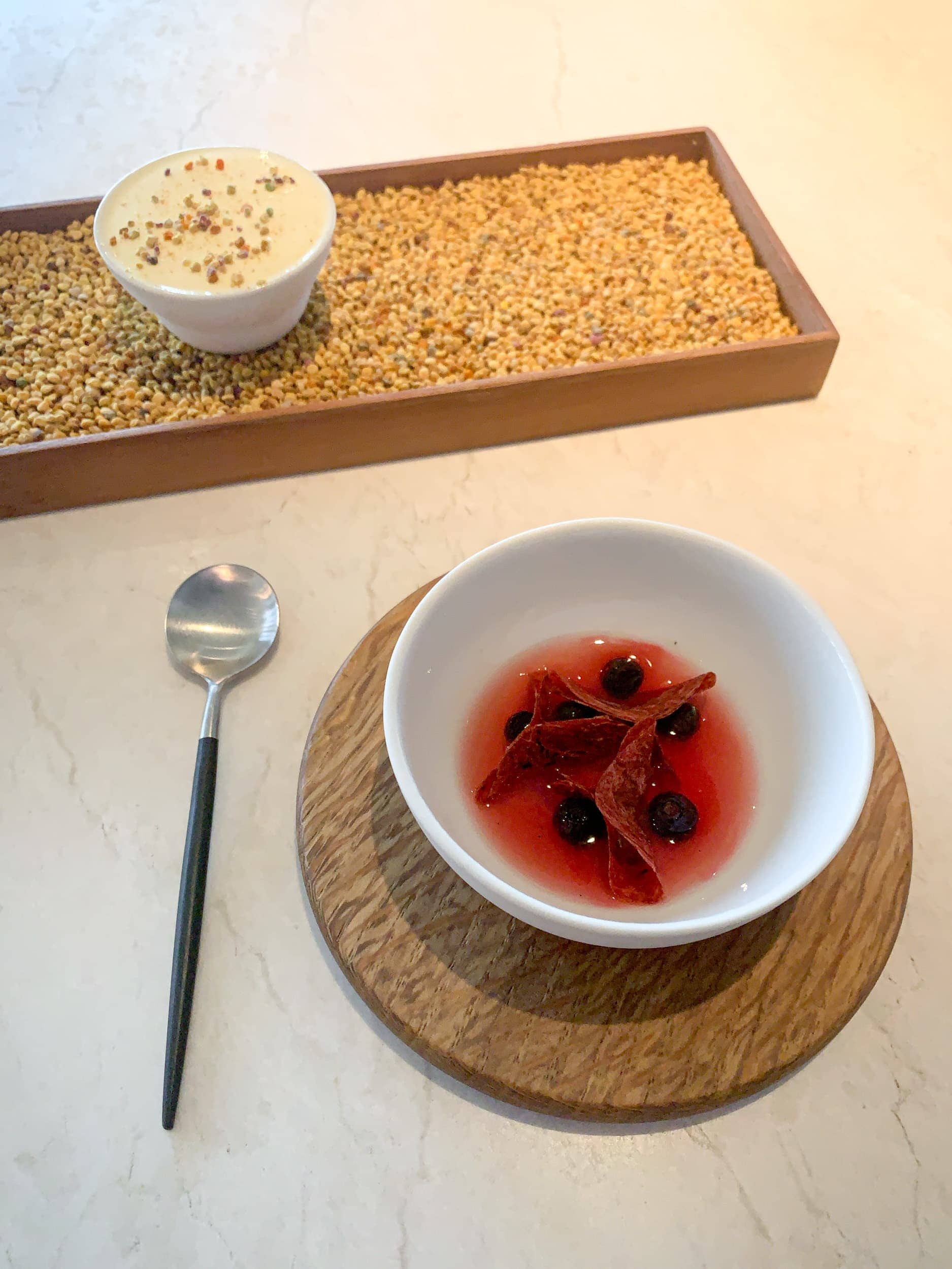 Beeswax and pollen ice cream with grilled rhubarb and blueberries