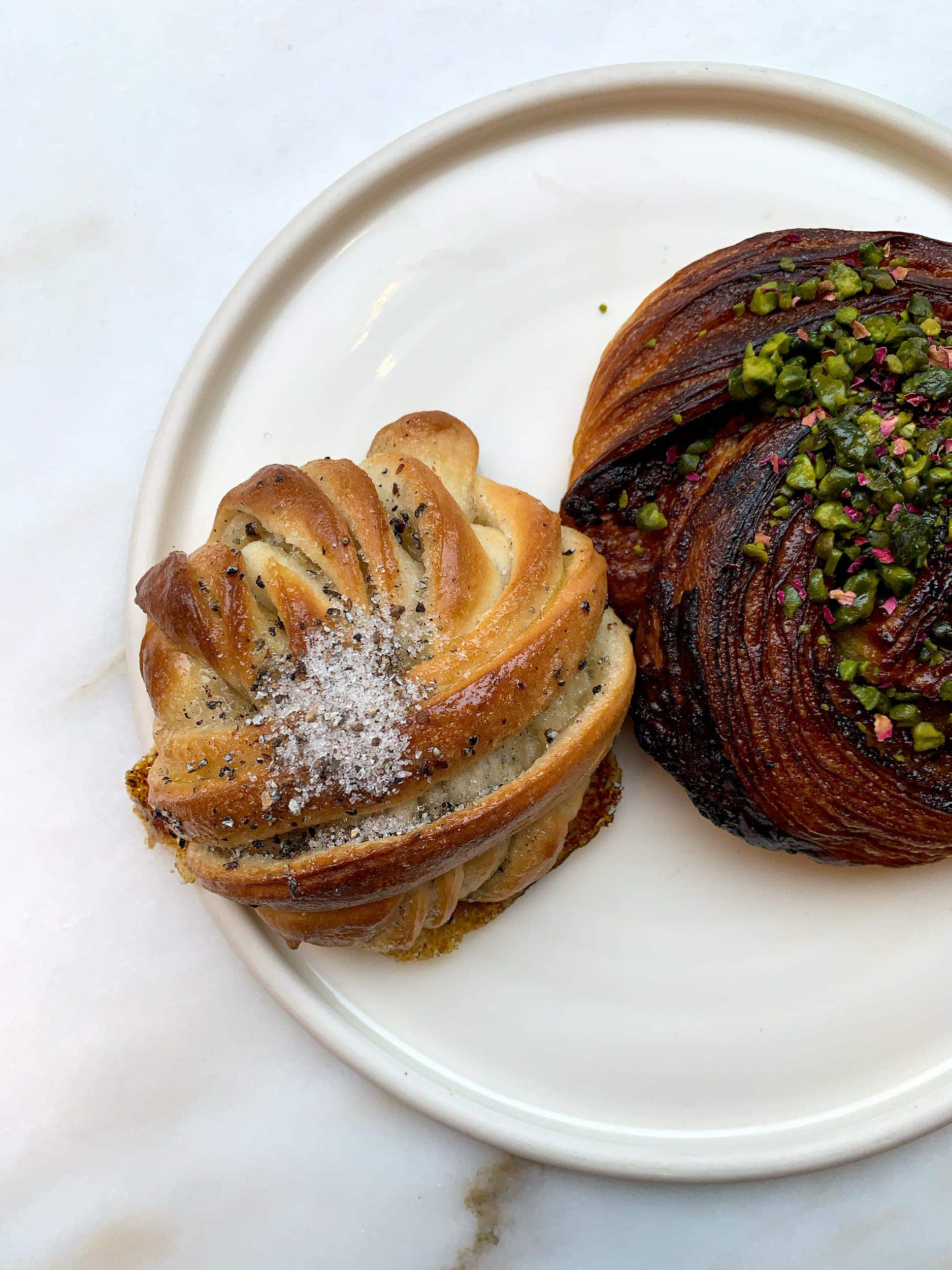 Cardamom bun and pistachio and rose croissant at Juno the Bakery