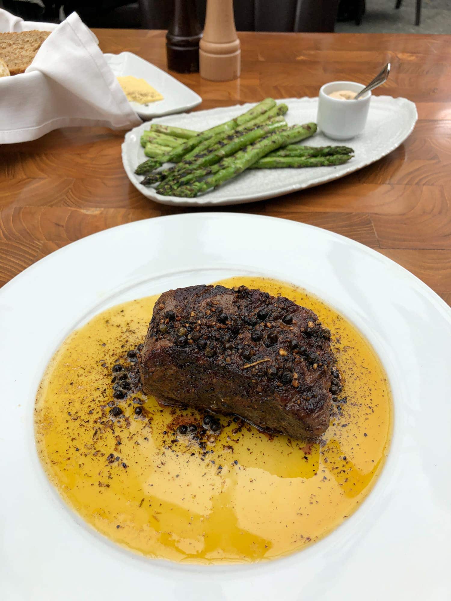 Beef filet with green and black pepper, tarragon butter and brandy