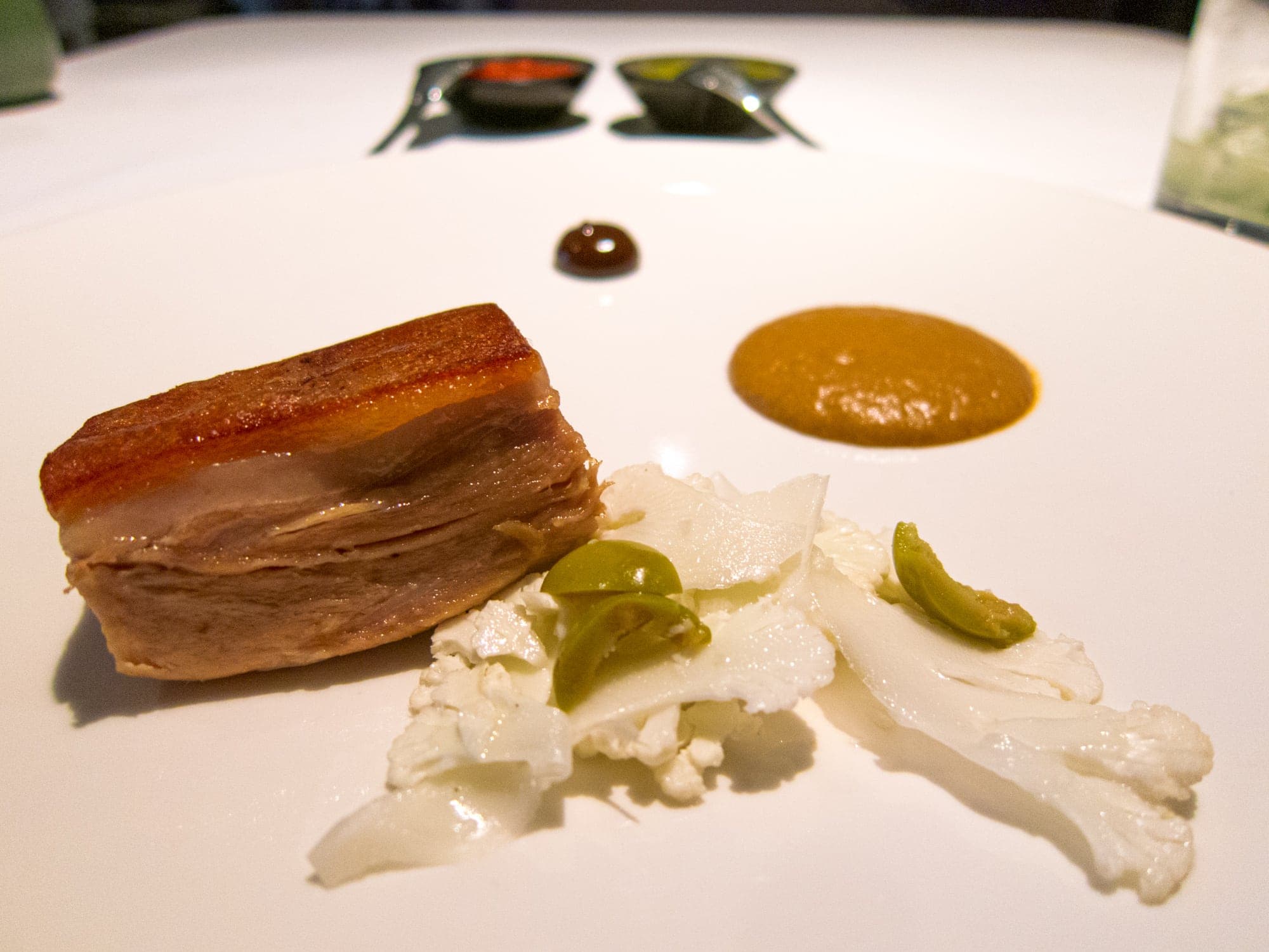 Pork confit, mole, tamarind, and white cabbage