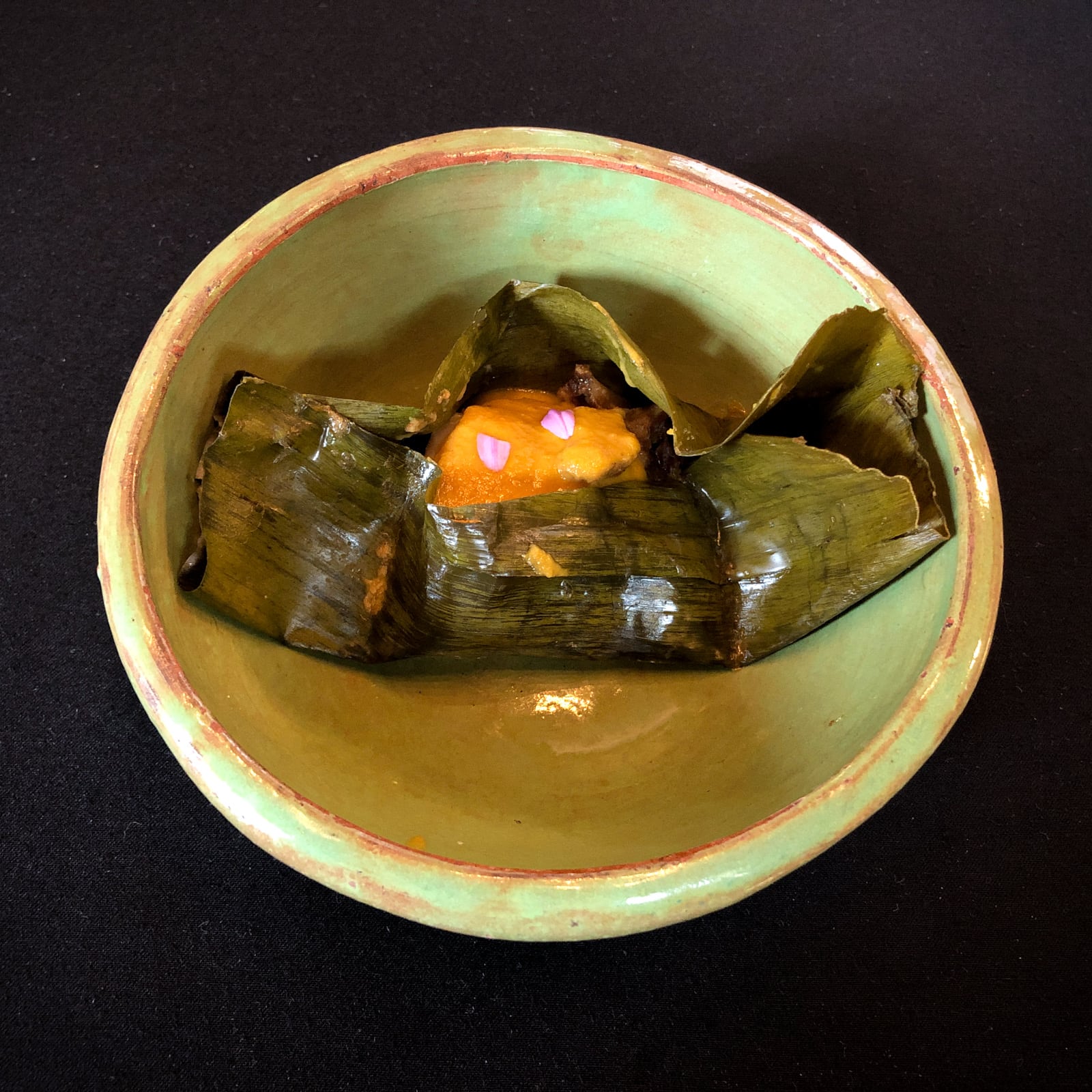 Fish wrapped in plantain leaf, sea snail, coconut rice