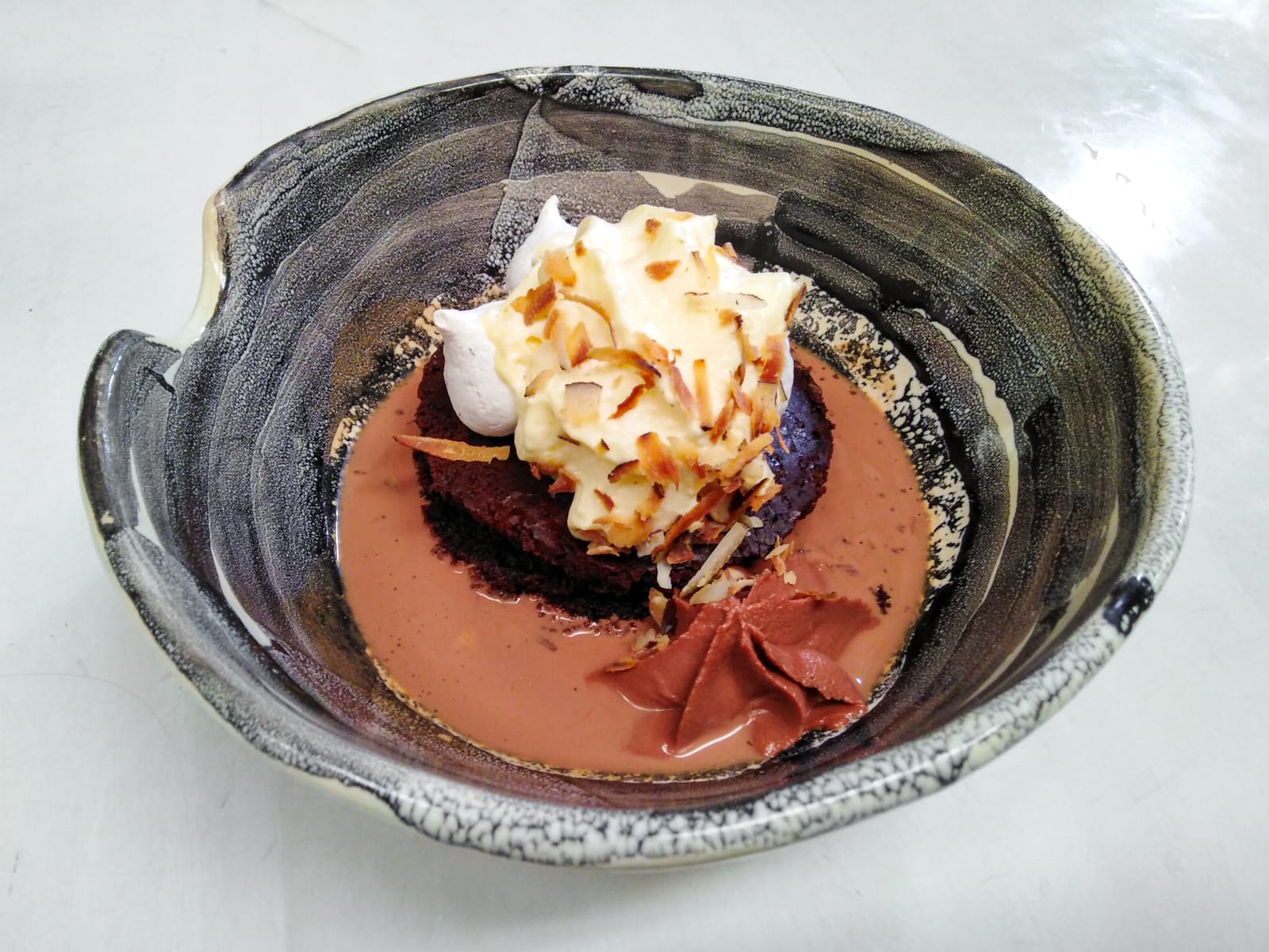 Devil's food cake, coconut pavlova, 76% cacao mousse, dark chocolate and chipotle soup