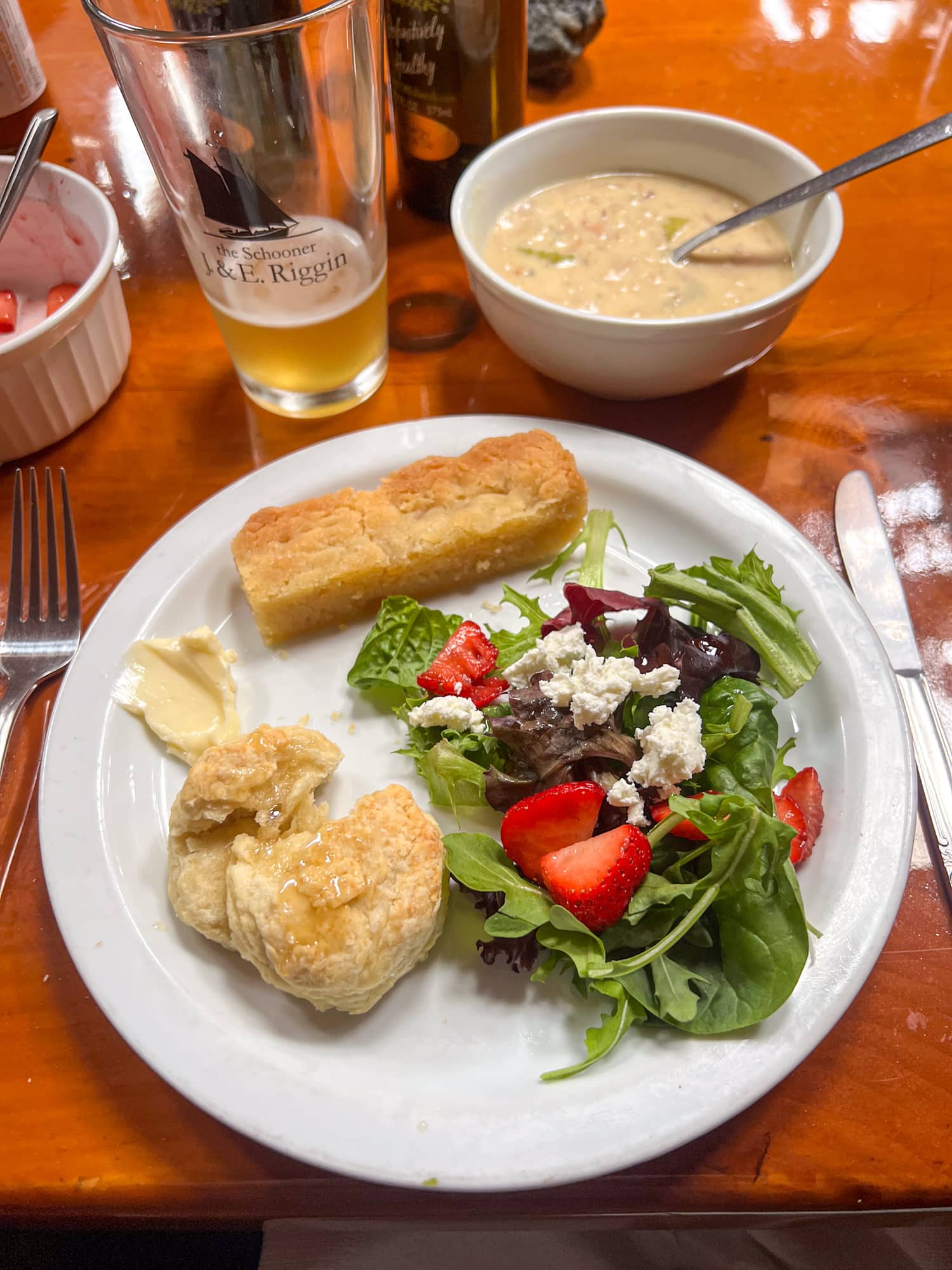 Biscuits and honey, goat cheese salad, and New England clam chowder