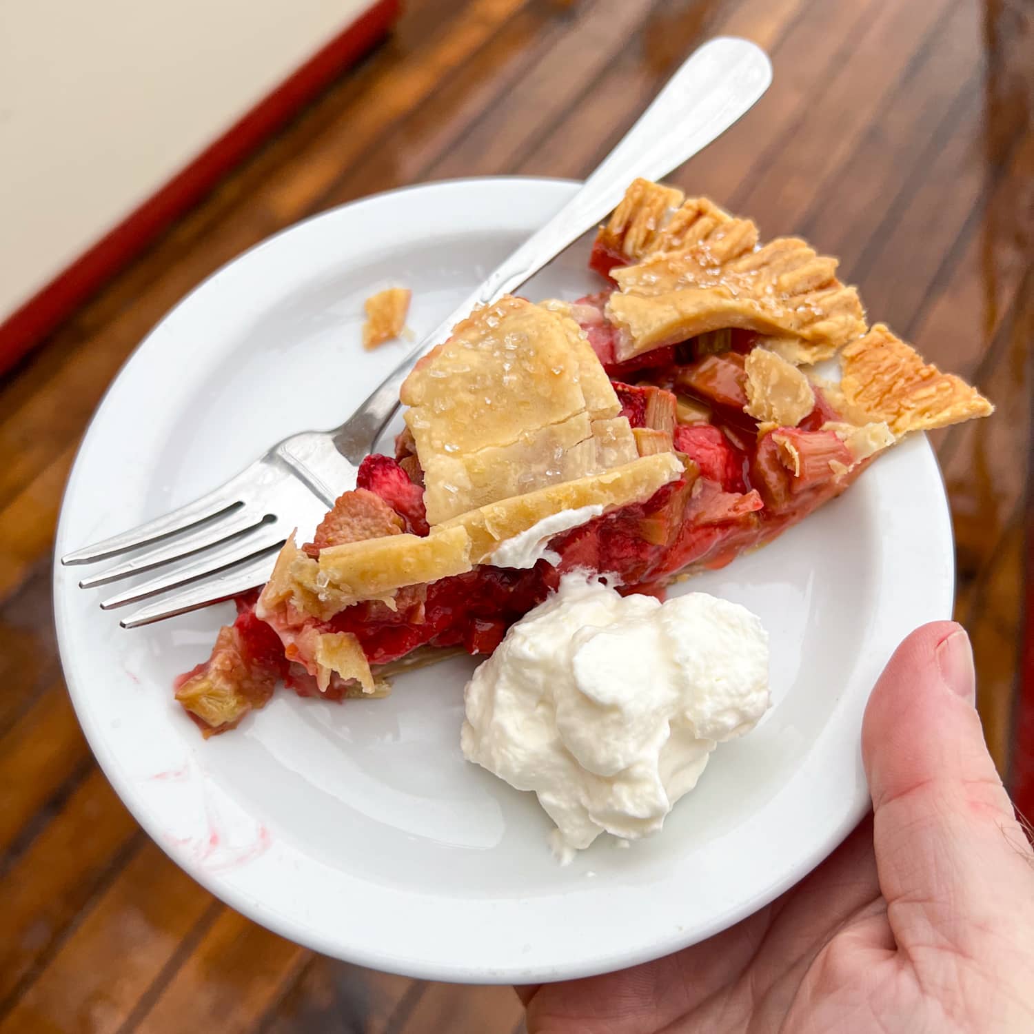 Strawberry rhubarb pie with whipped cream