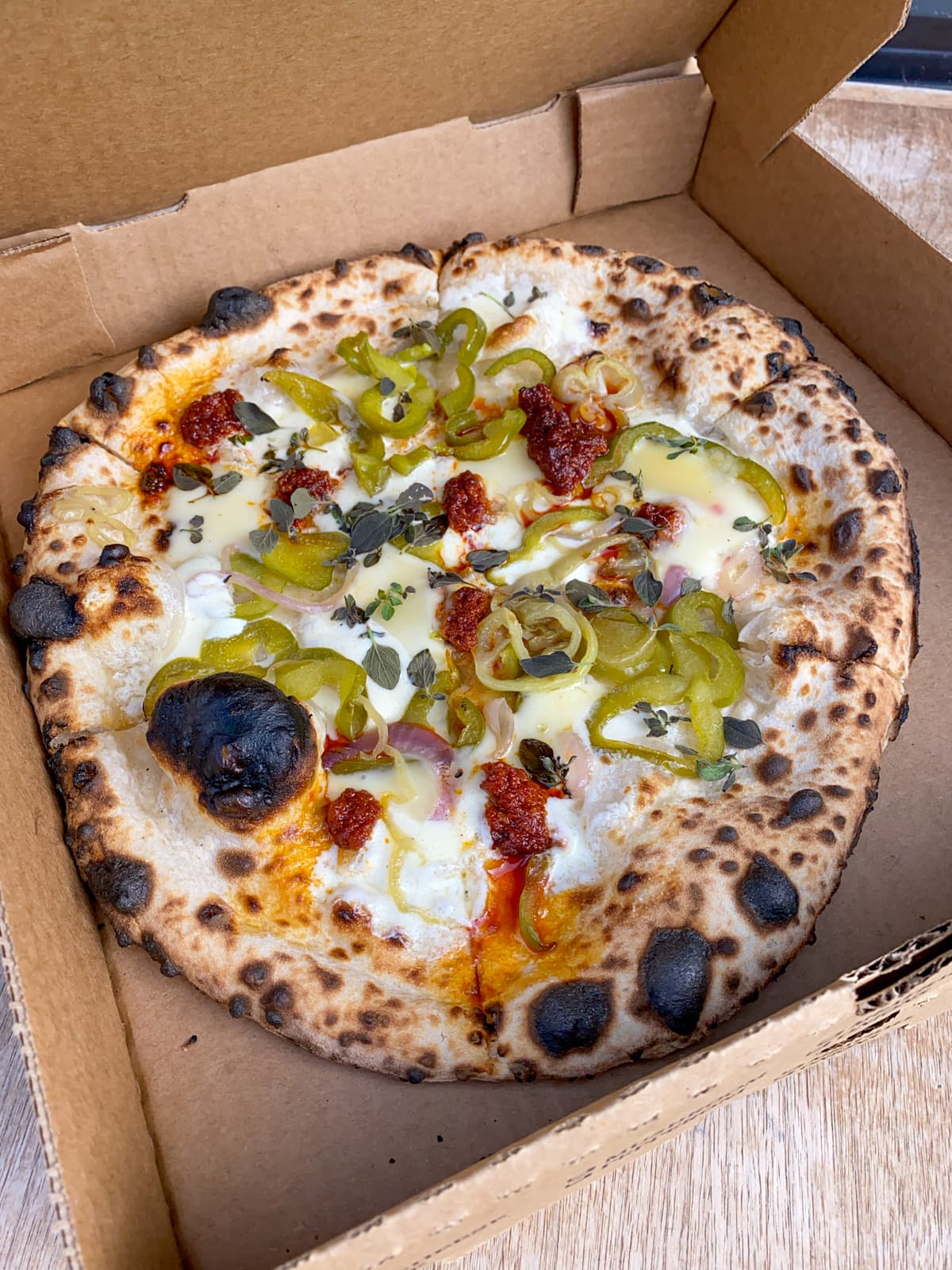 Nduja, sweet peppers, onions, fontina, mozzarella - a Kevin Fink collaboration with Bufalina pizza