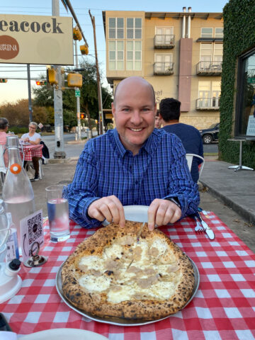 Dave with cacio e pepe and white truffle pizza at Bufalina