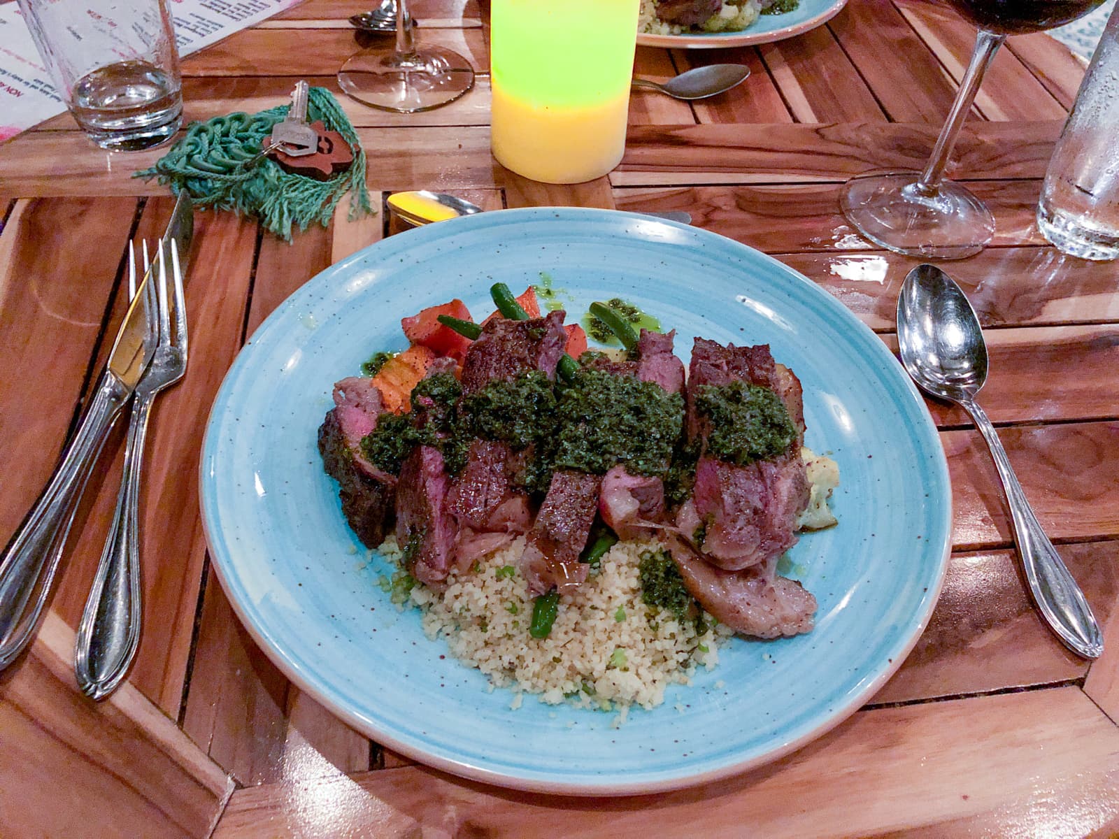 Steak with chimichurri sauce and couscous