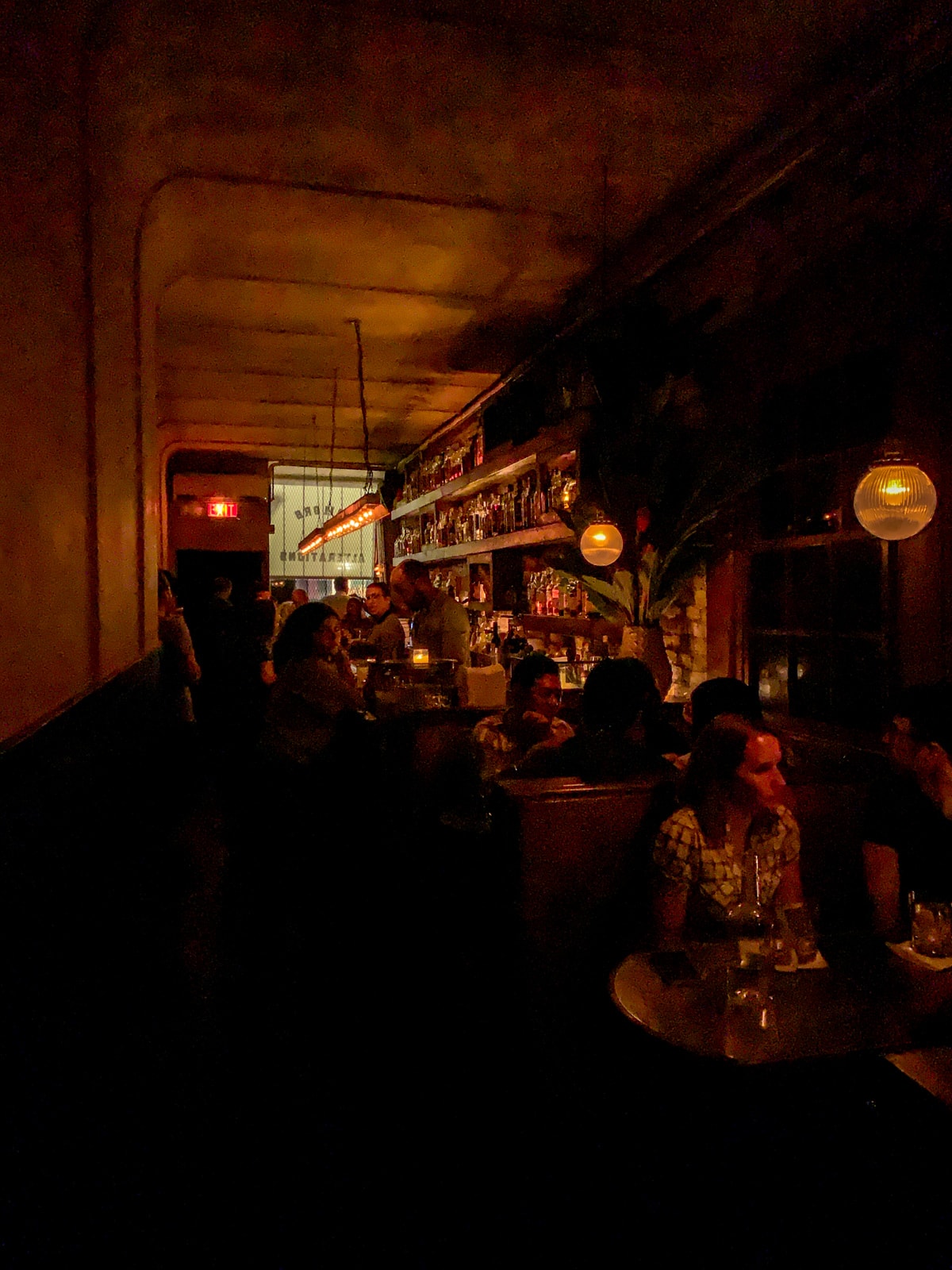 Dimly-lit Attaboy cocktail bar