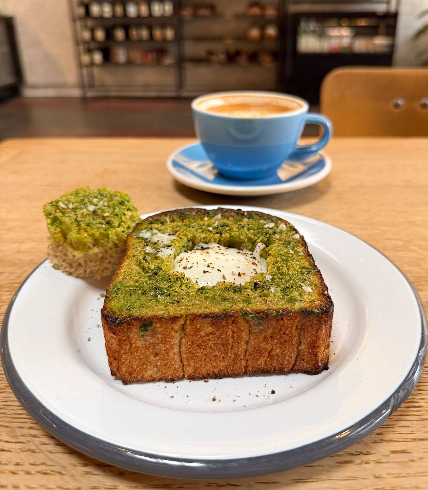 Thick-cut V Toast with a poached egg and cappuccino at Josey Baker Bread and The Mill in San Francisco.
