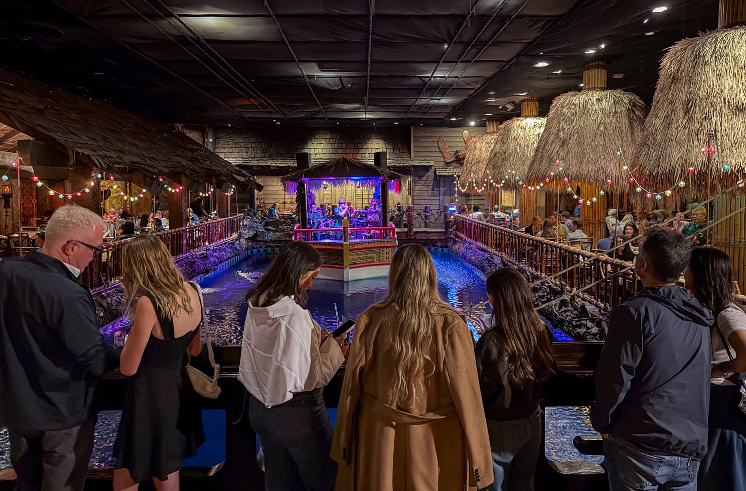 Guests watching the floating stage and indoor lagoon at the Tonga Room and Hurricane Bar at the Fairmont Hotel.