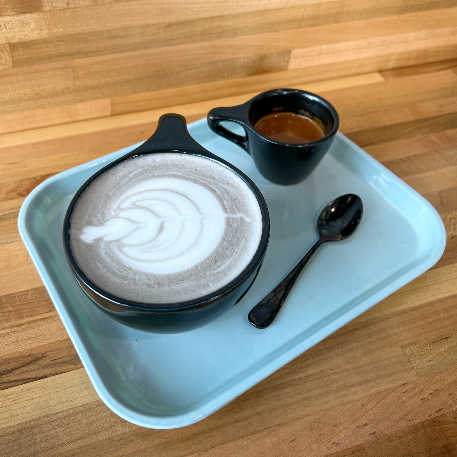 Black sesame latte with a shot of espresso at Ovenbird, one of the best cafes in Austin, TX