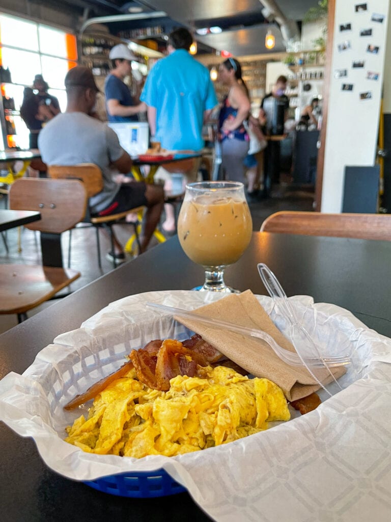 Scrambled eggs and bacon with coffee at Brew and Brew, one of the best cafes in East Austin.