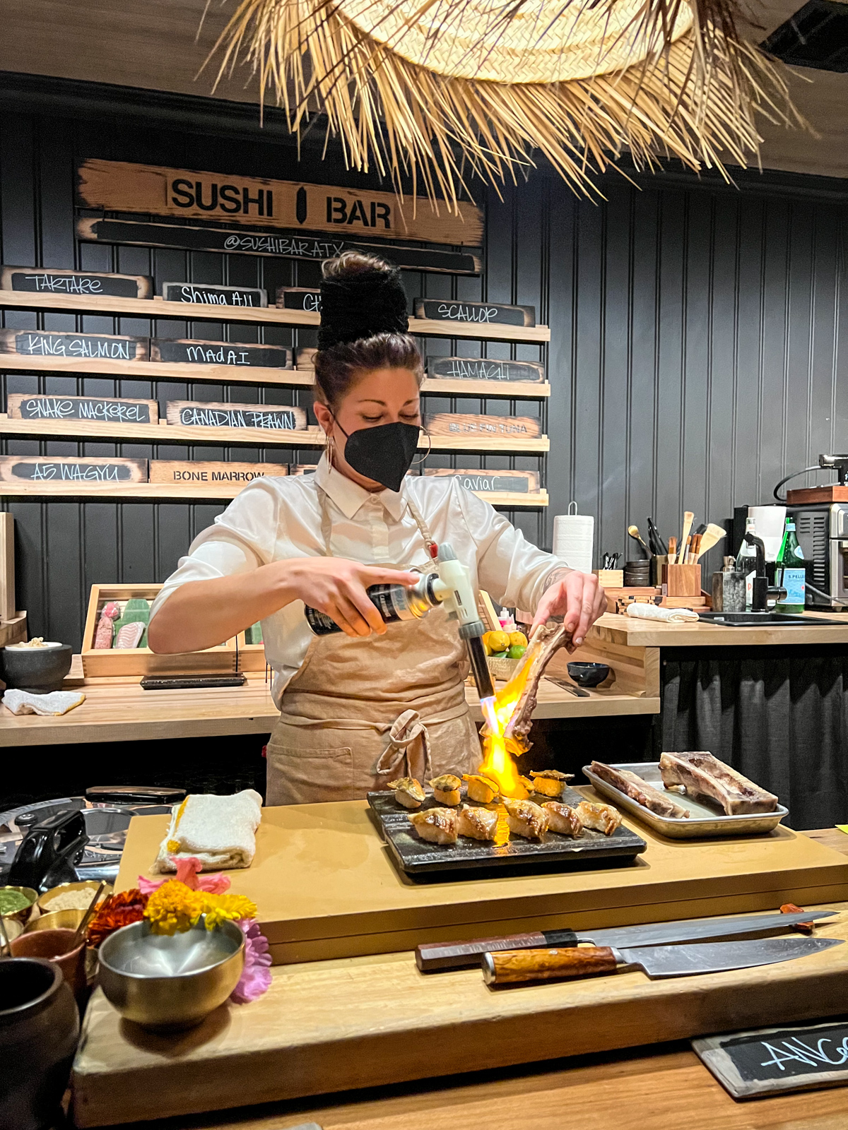 Chef Ambrely torches bone marrow at Sushi Bar ATX