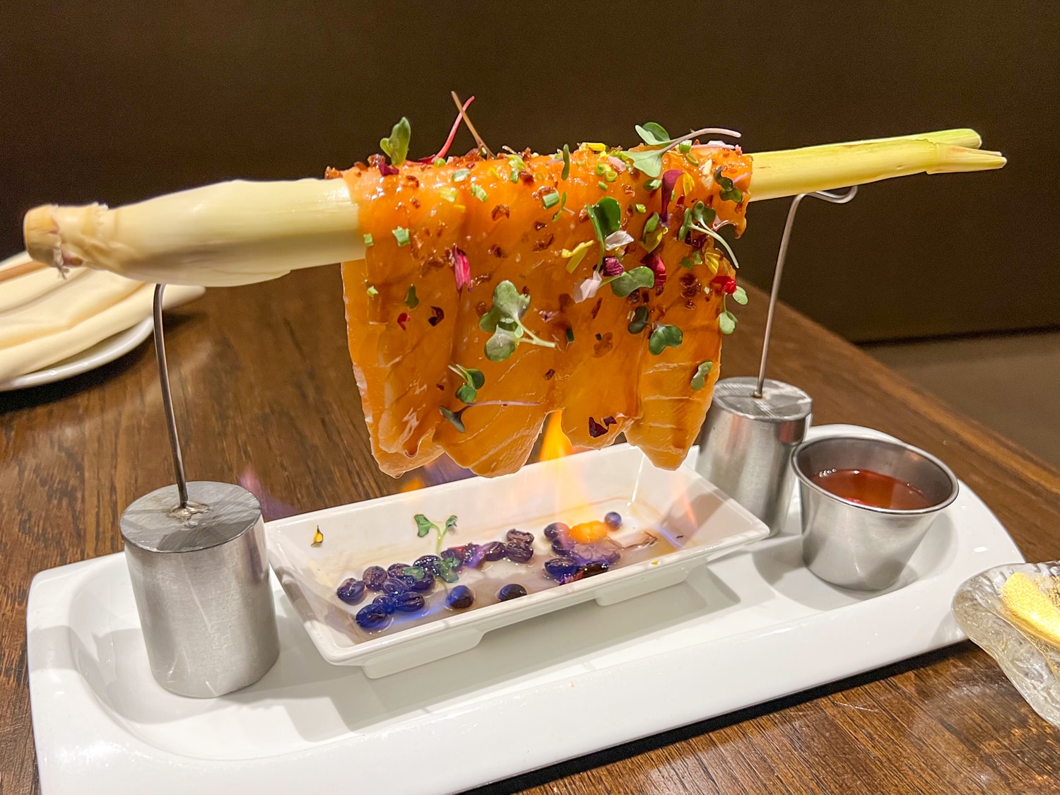 Fire salmon served over an open flame at Soto in North Austin, TX