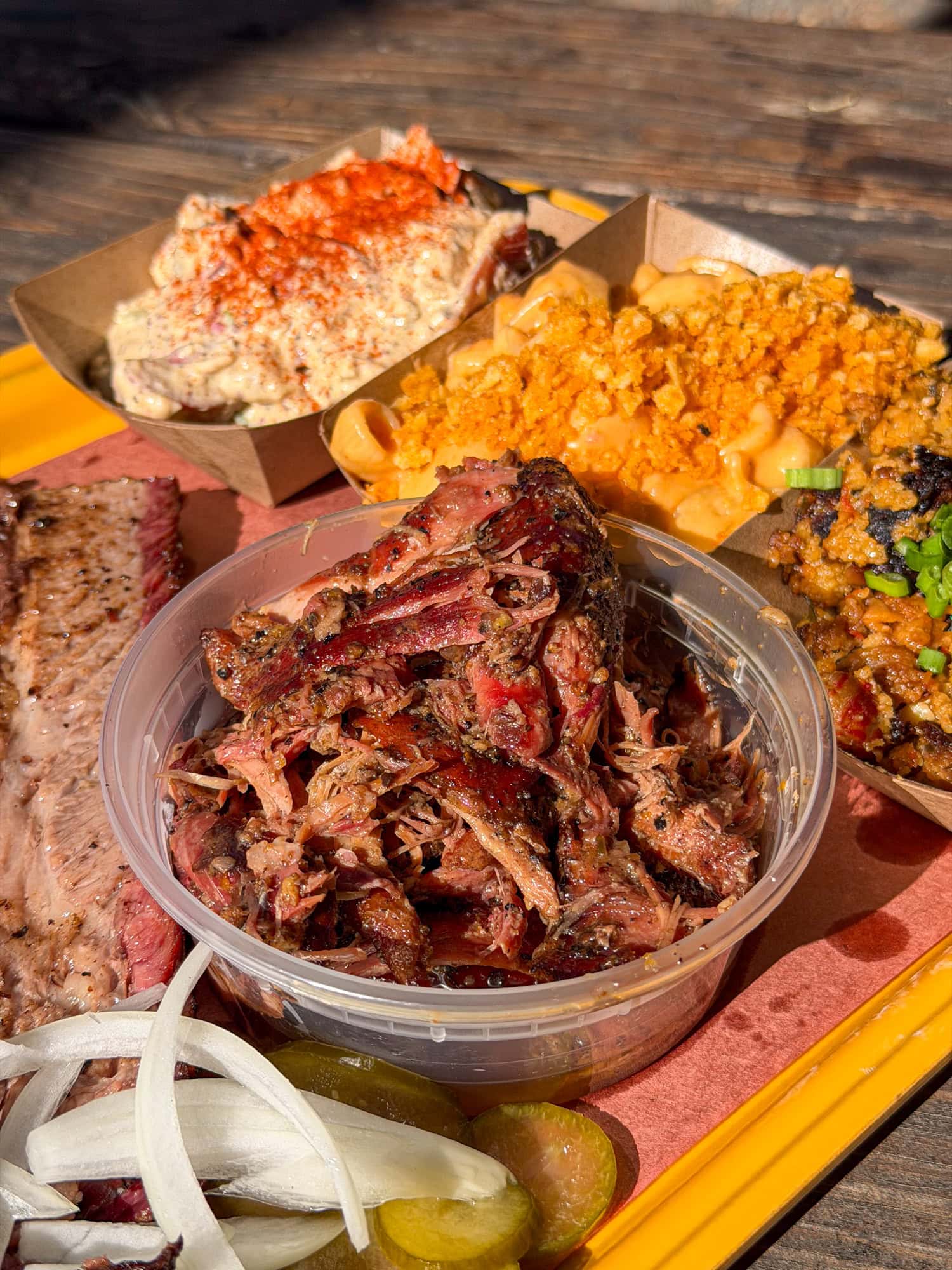 Pulled duck, brisket, and sides at Parish Barbecue in East Austin.