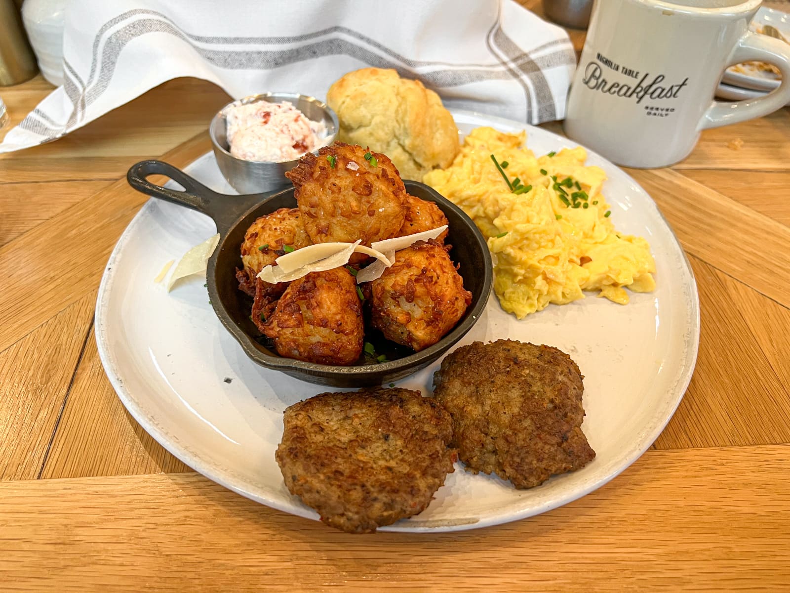 Magnolia Table farm breakfast with eggs, sausage, and tater tots 