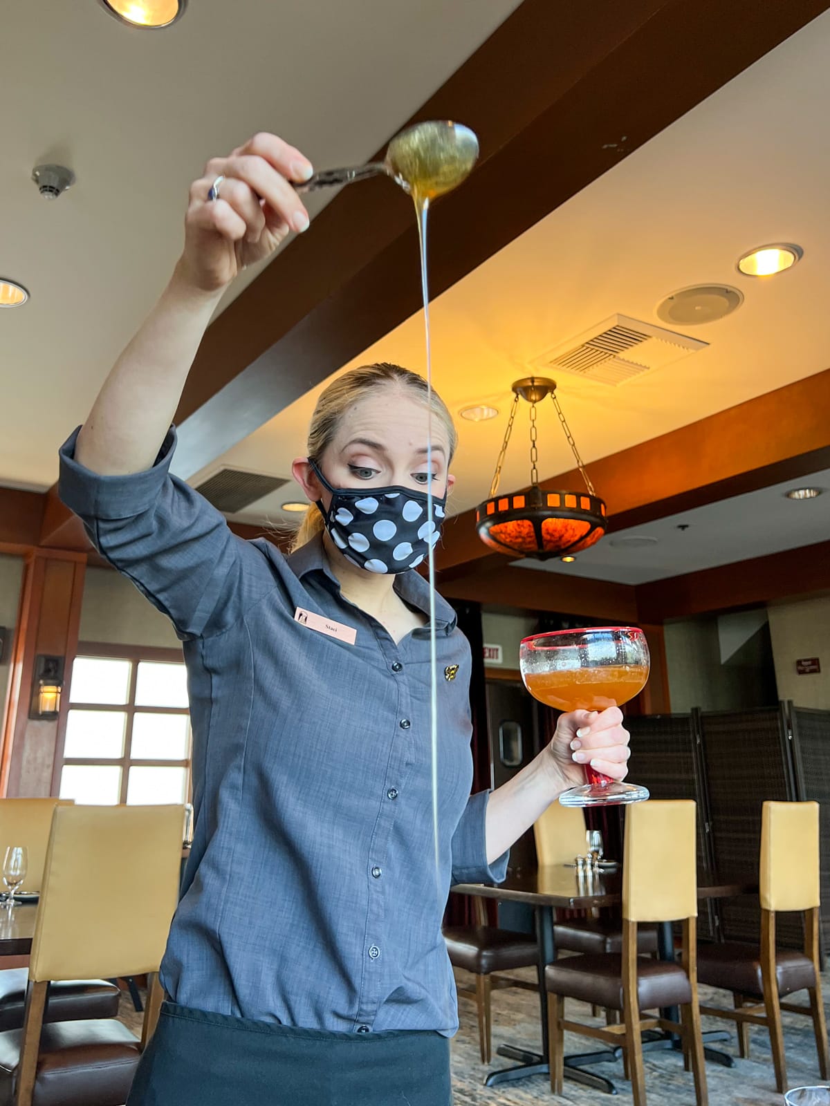 Our server pours the Salish Lodge restaurant's signature "honey from heaven" on the biscuits.