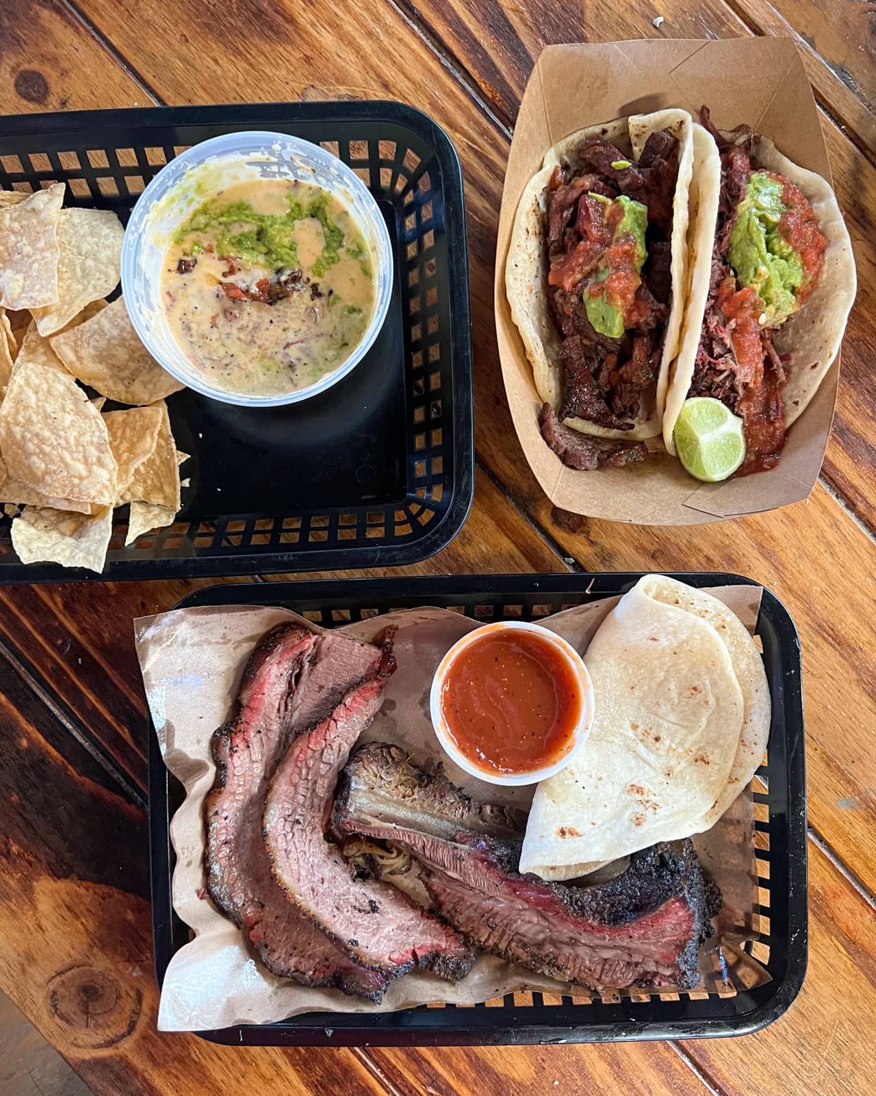 Tacos, brisket, beef rib, and queso at Valentina's Tex Mex BBQ