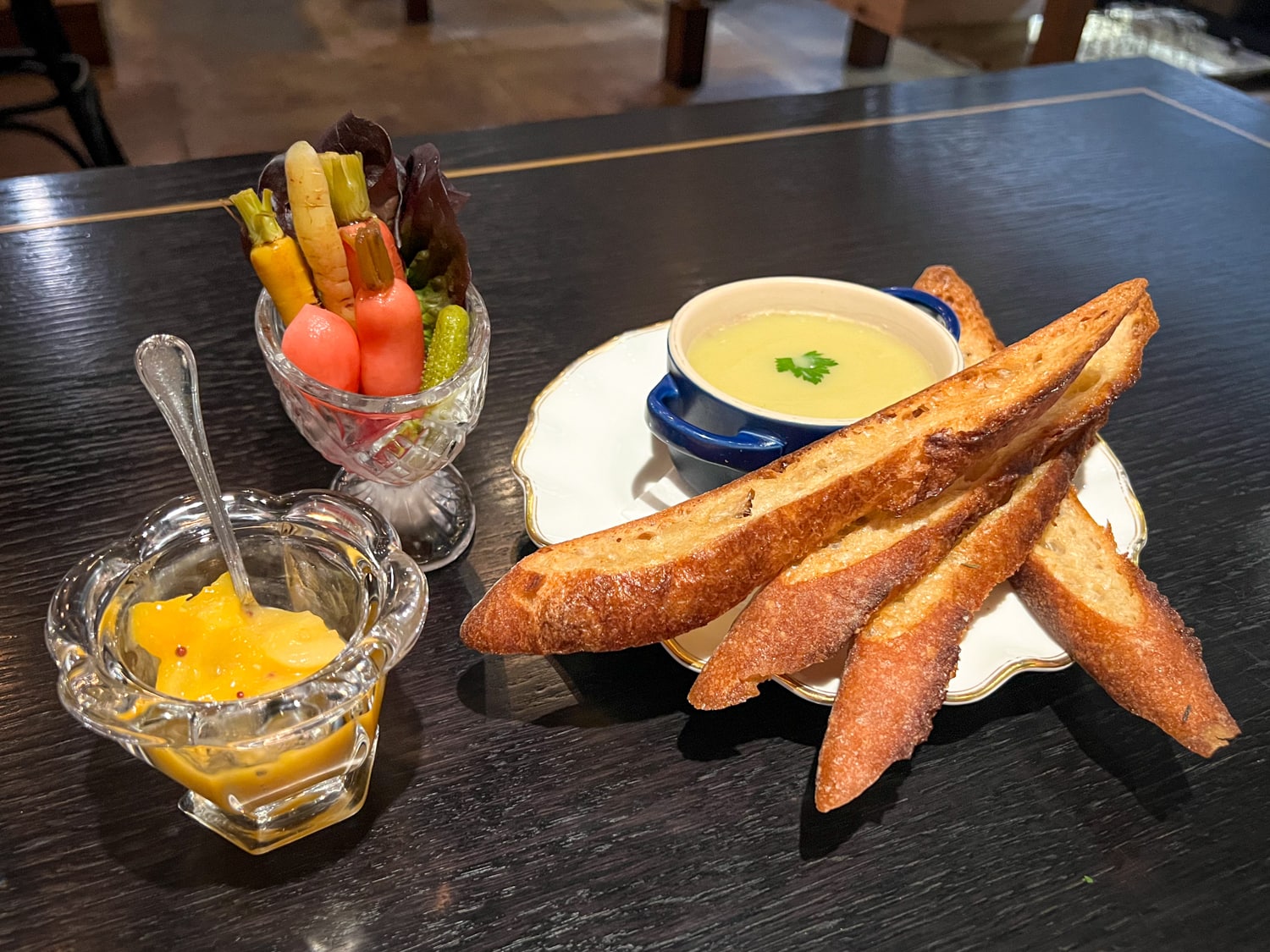 Duck leg rillettes with pickled vegetables, apricot and mustard jam, and baguette