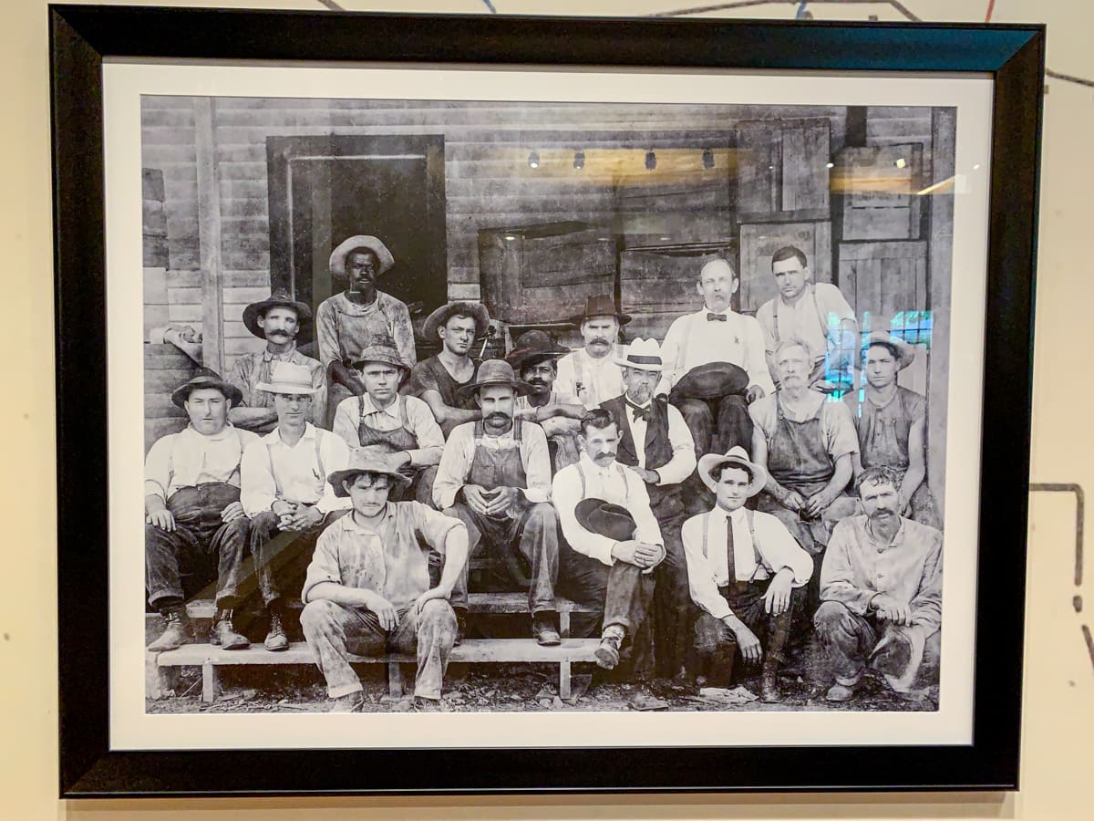 Photo of Jack Daniel's with his employees