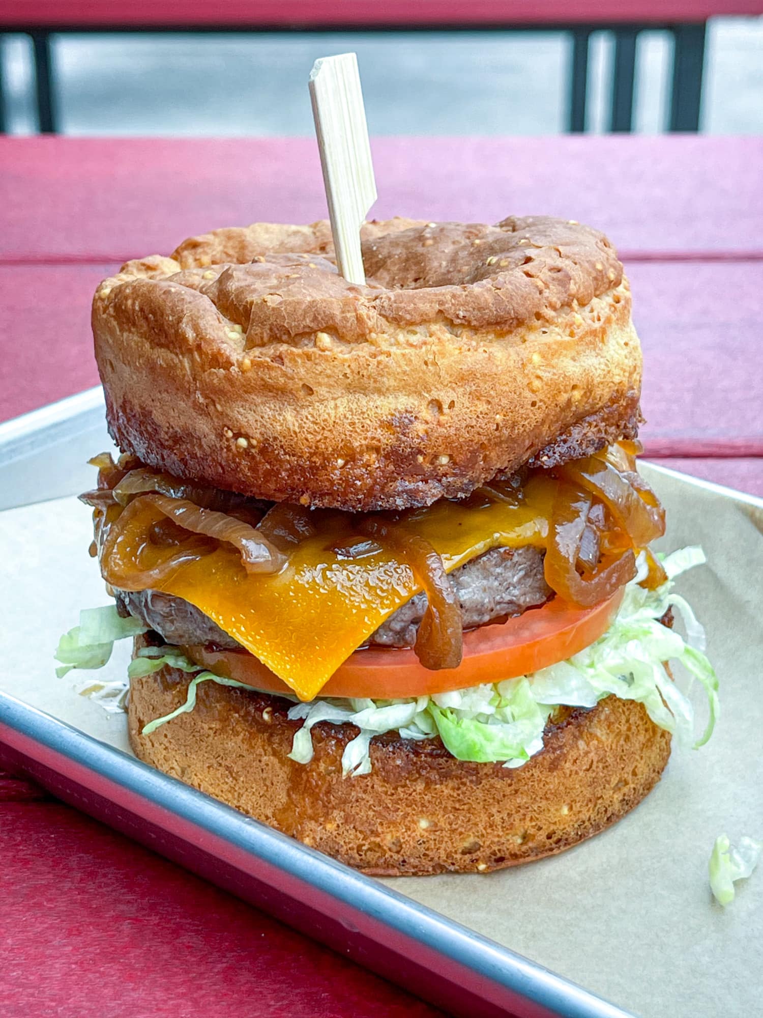 Hopdoddy's classic cheeseburger with caramelized onions on a gluten-free bun