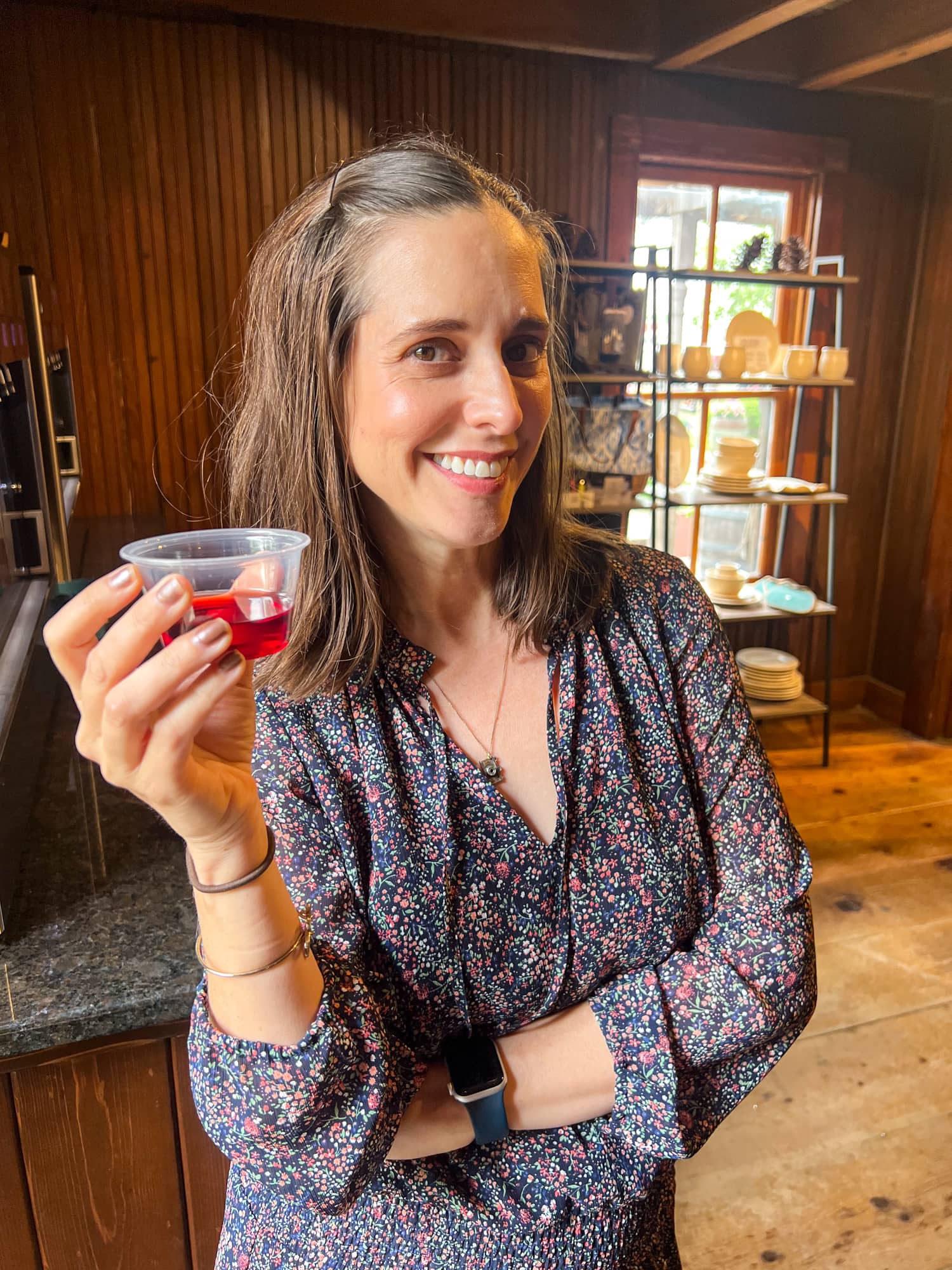 Kel is happy with her blackberry wine at Das Peach House in Fredericksburg, TX