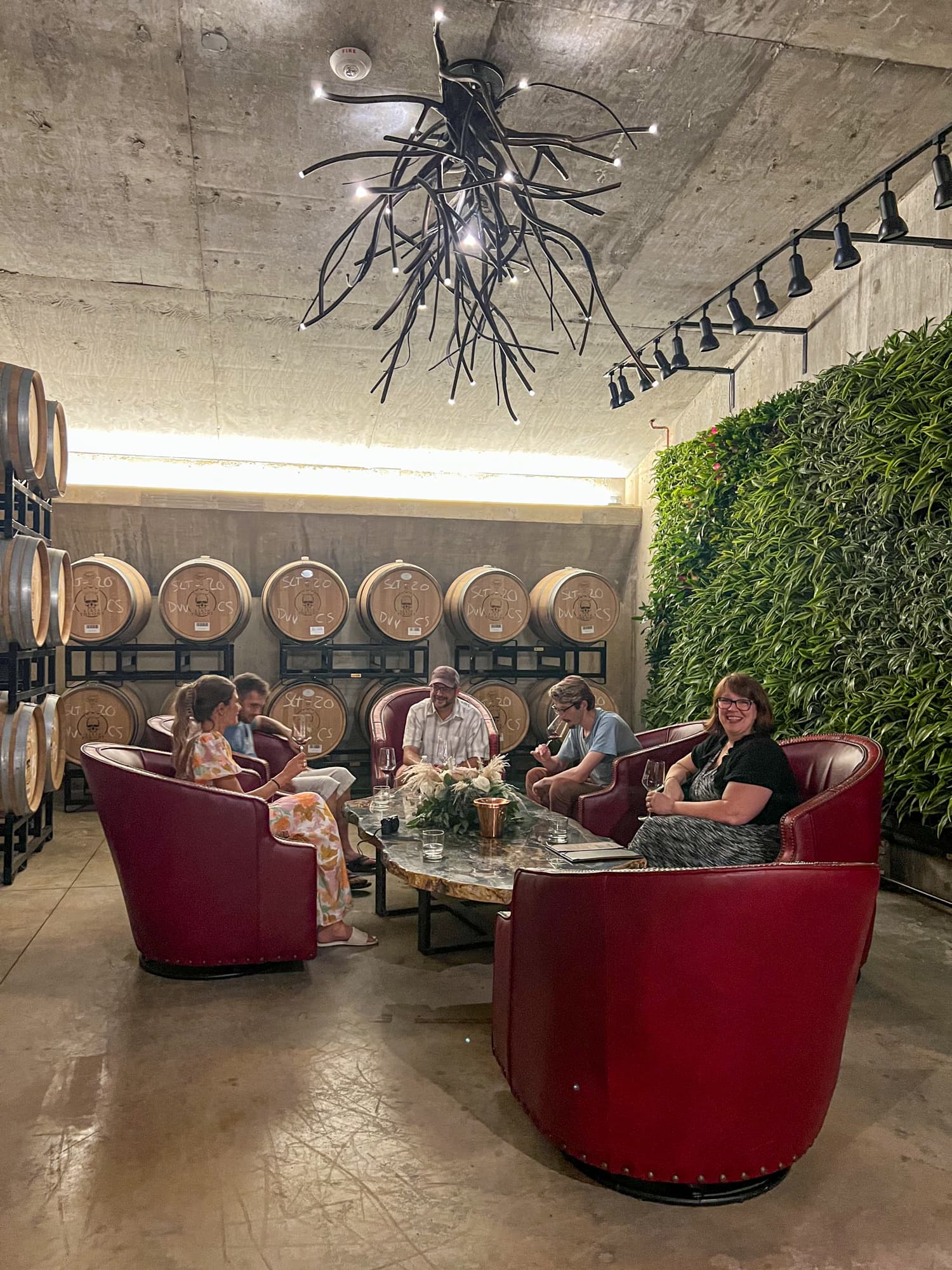 Visitors enjoy a wine tasting in Slate Theory's wine cave, the only one in Fredericksburg, TX