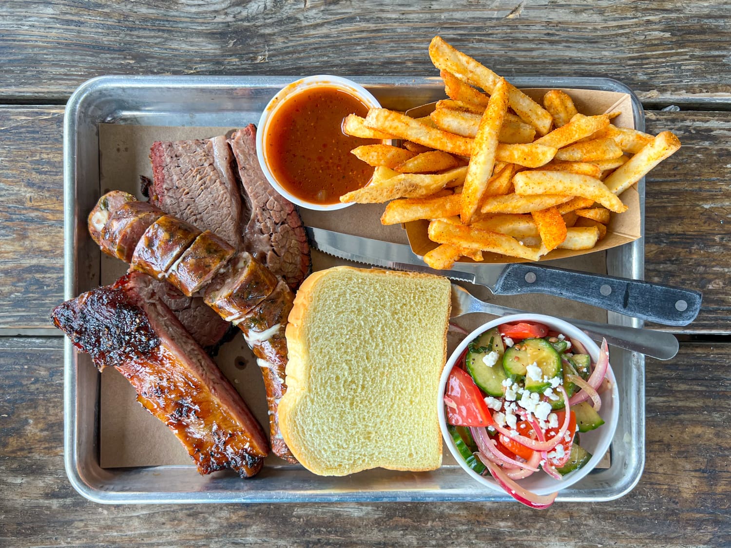 Brisket, pork rib, and cheesy sausage at Stiles Switch BBQ