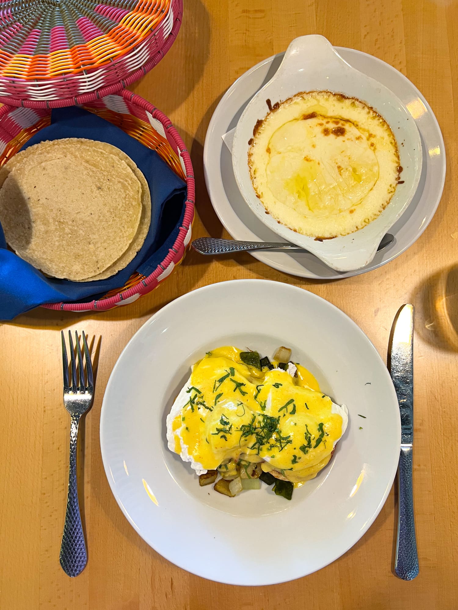 Huevos Benedictos with Oaxacan cheese and corn tortillas at El Naranjo in South Austin, Texas