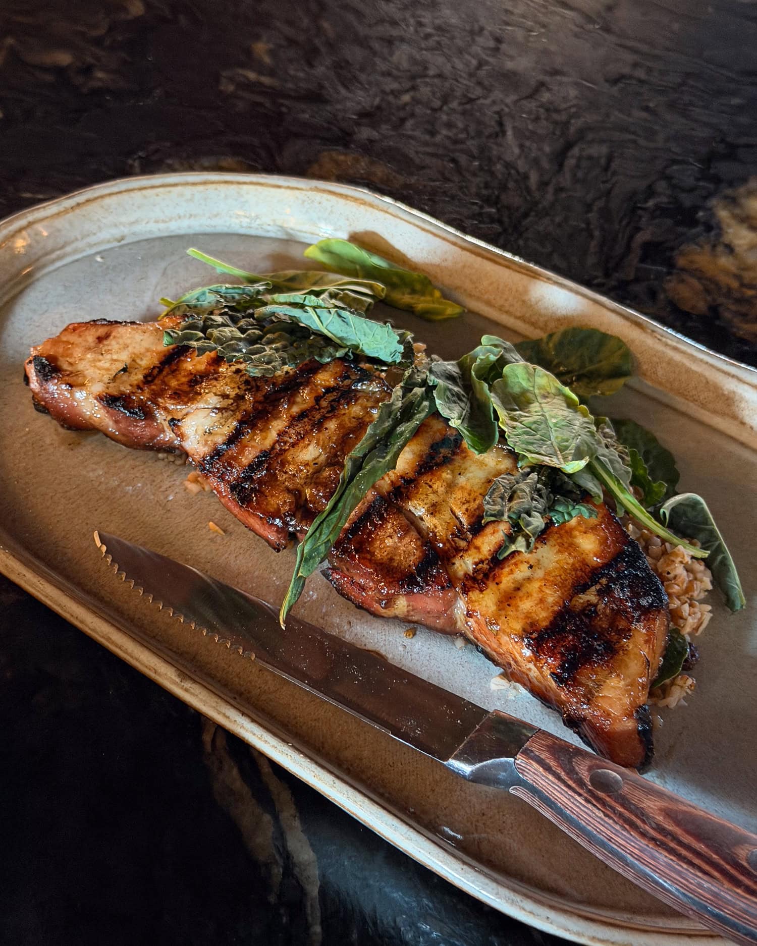 Grilled pork belly with apple butter and kale-and-currant tabbouleh at Red Herring