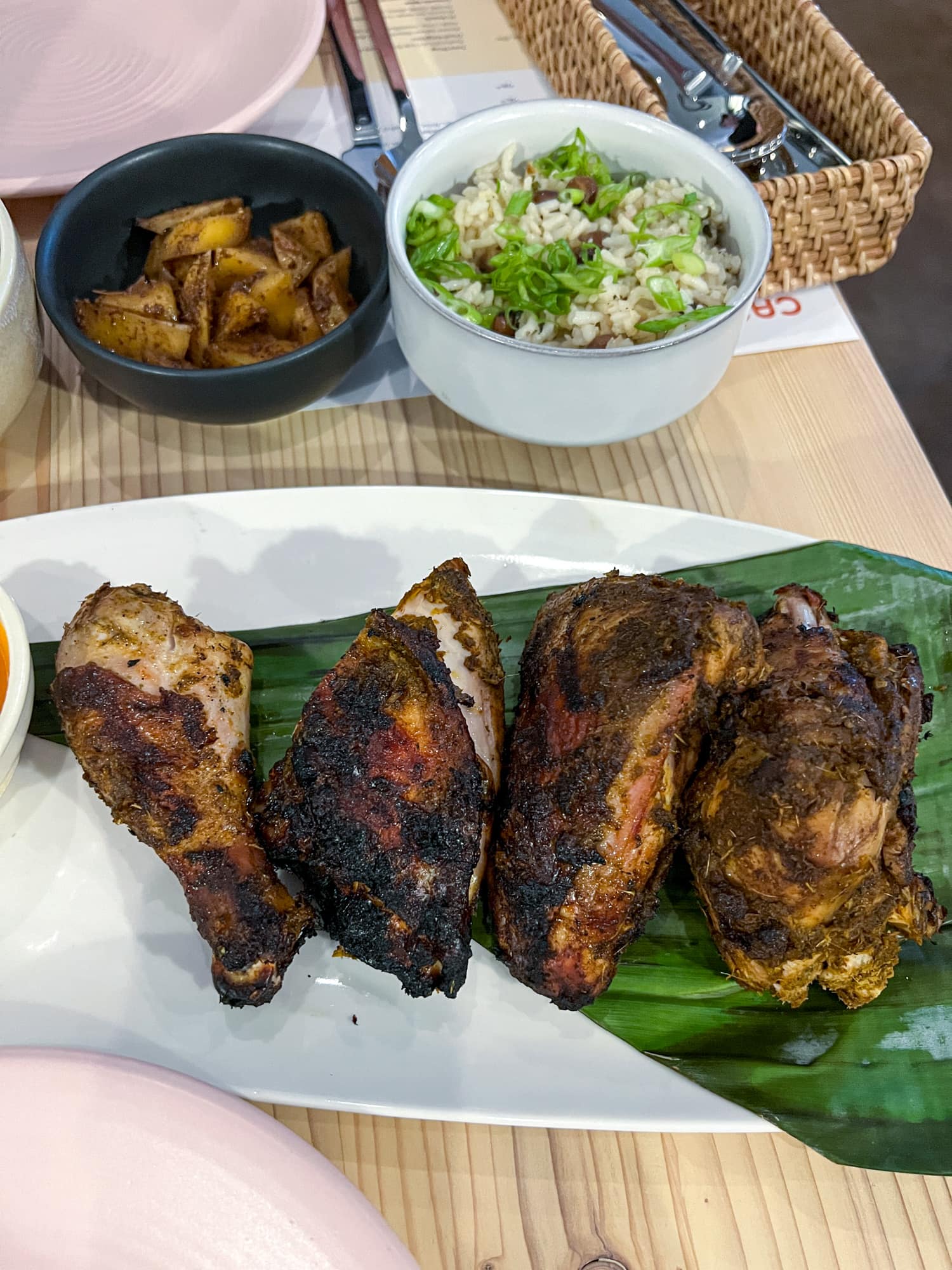 Jerk chicken and Carolina gold rice at Canje, one of the best restaurants in East Austin, TX