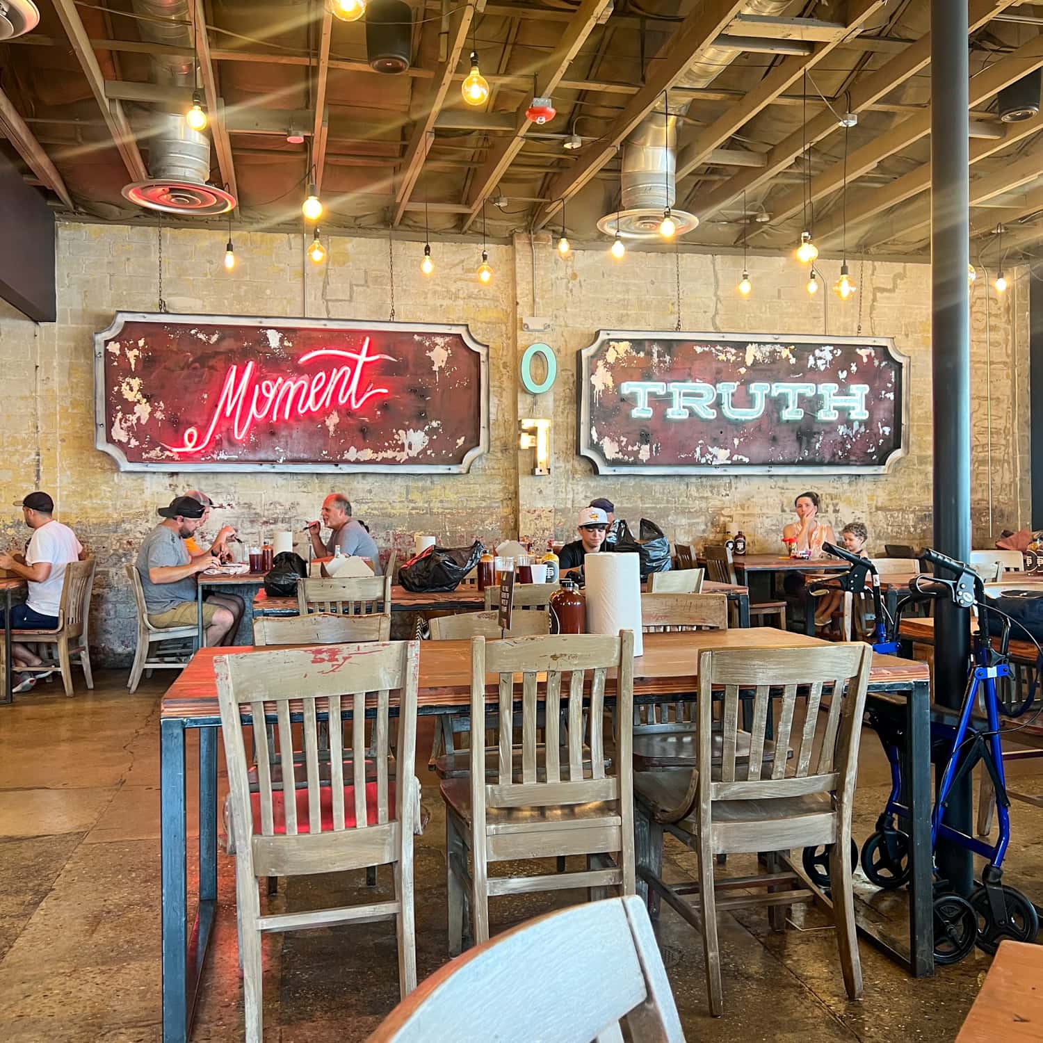 Truth BBQ dining room with signs saying "Moment of Truth"