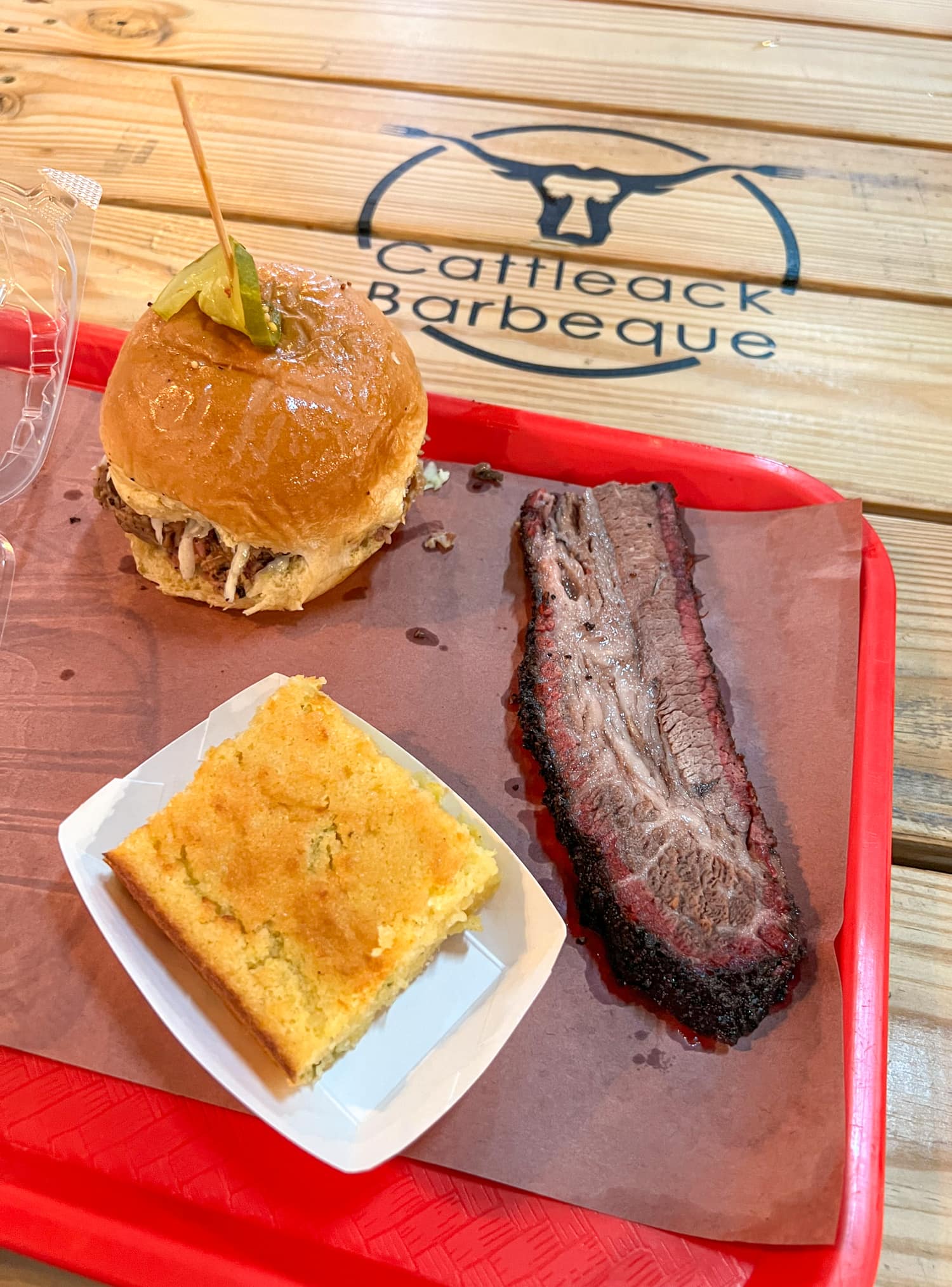 Brisket, pork sandwich, and cornbread at Cattleack Barbeque, one of the best restaurants in the Dallas metroplex