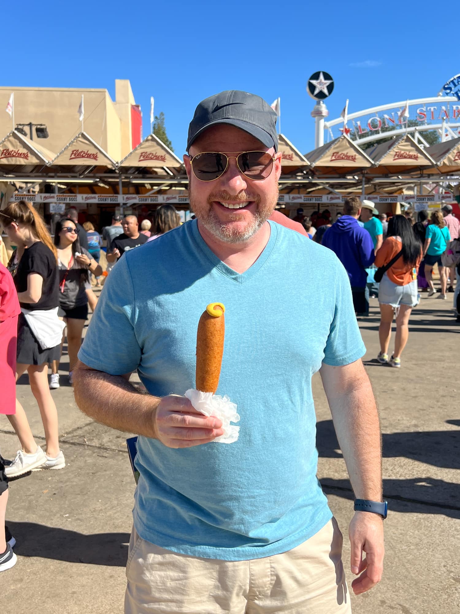 Dave with his first Fletcher's corny dog at the Texas State Fair 2022 (photo by Kelly Lemons)