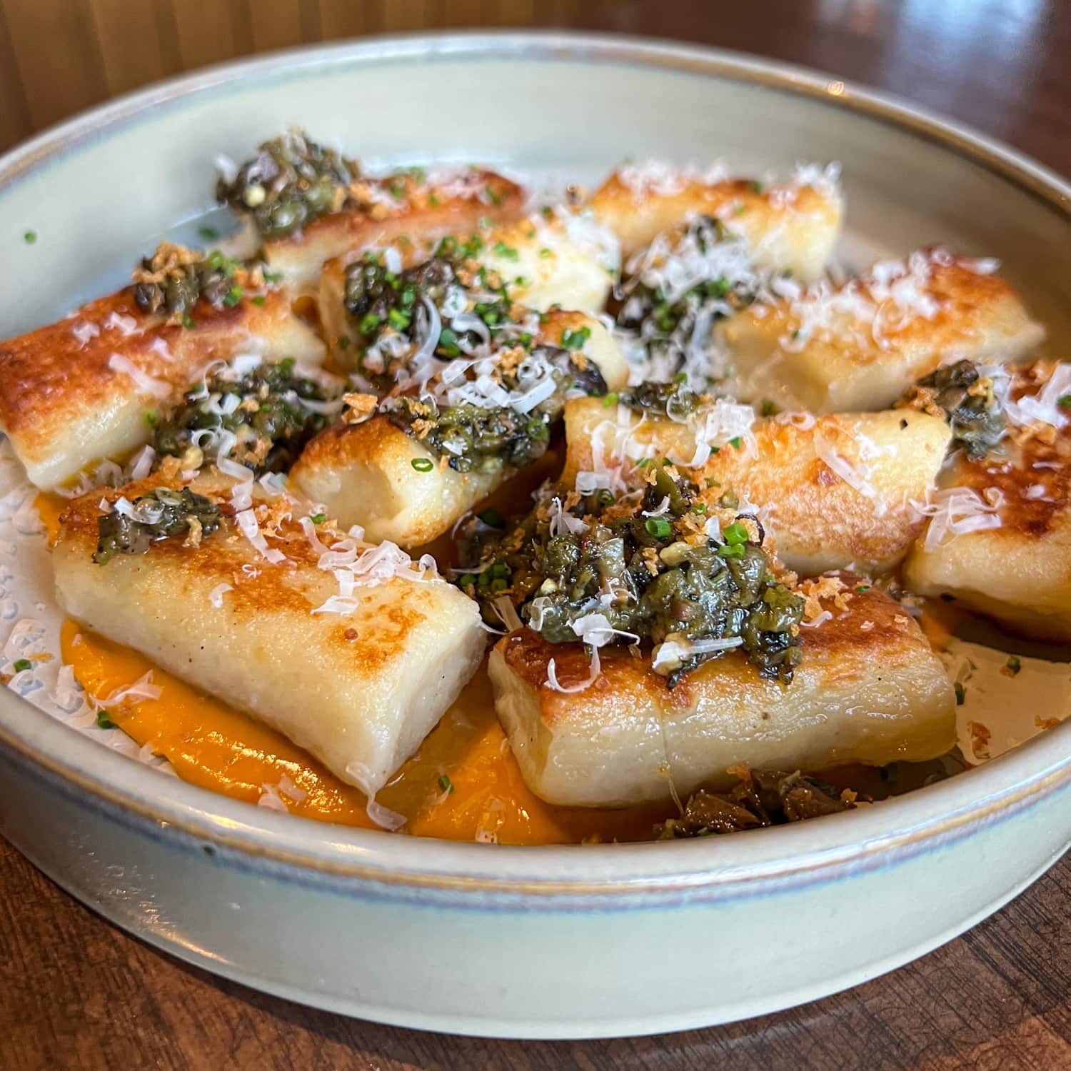 Ricotta gnocchi with sungold tomato, shishito, smoked maitake relish, and parmesan