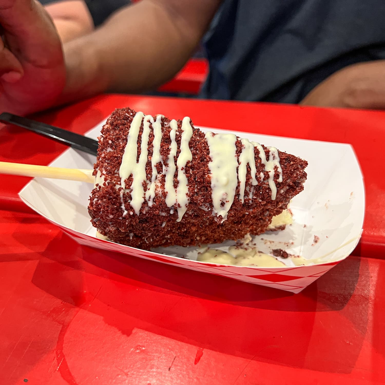 Cheesecake on a stick with red velvet cake was a new food at the Texas State Fair 2022 (photo by Kelly Lemons)