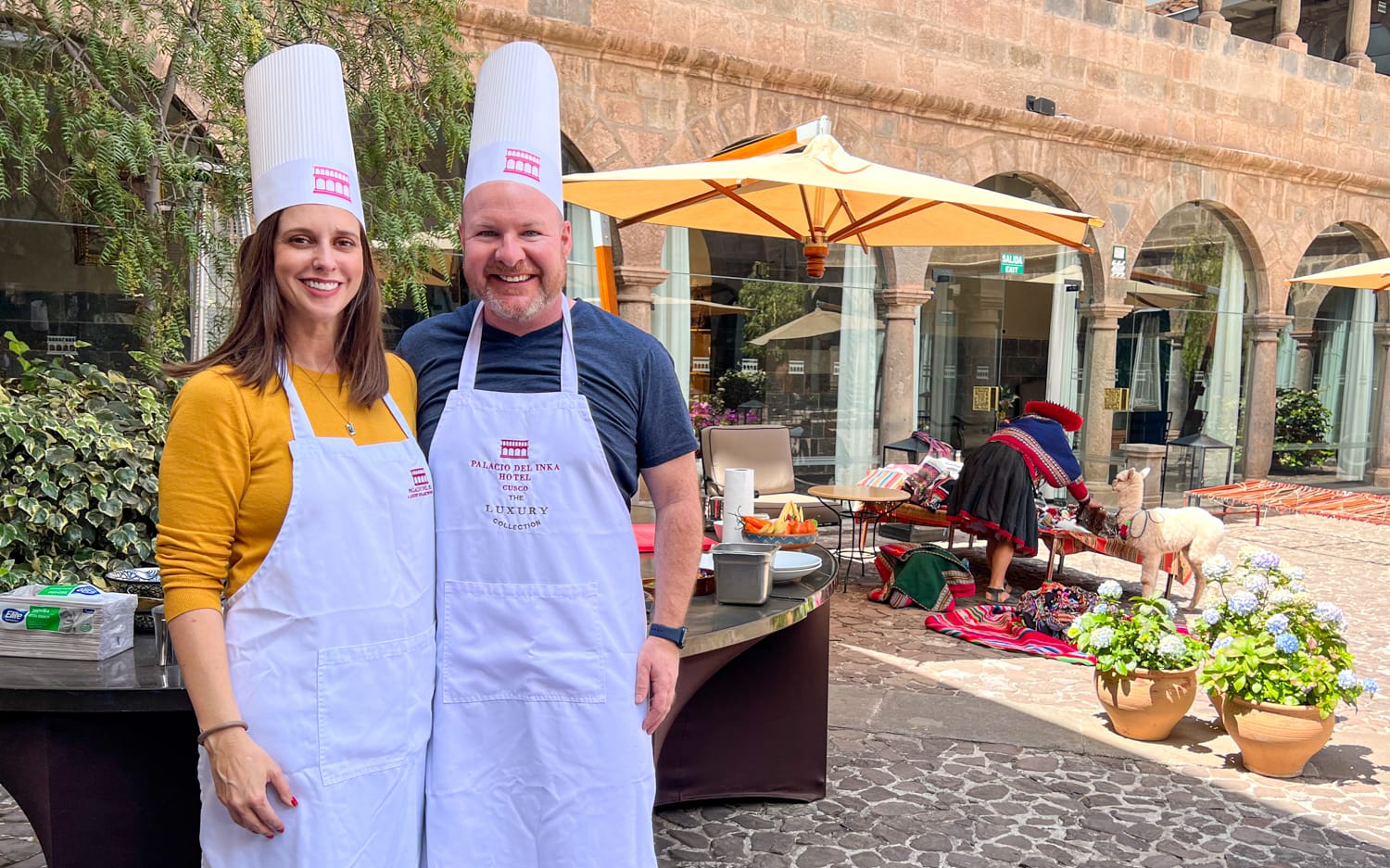 Dave and Kel in aprons at the start of their first cooking class in Cusco, Peru