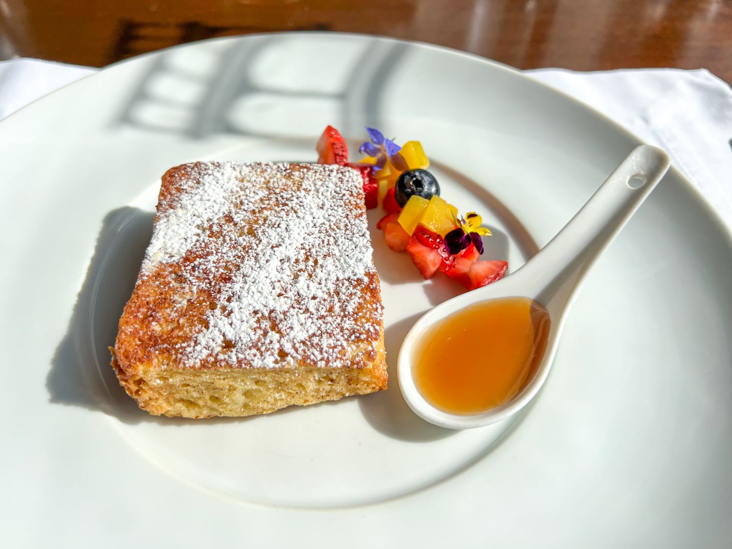 French toast with maple syrup and fresh fruit